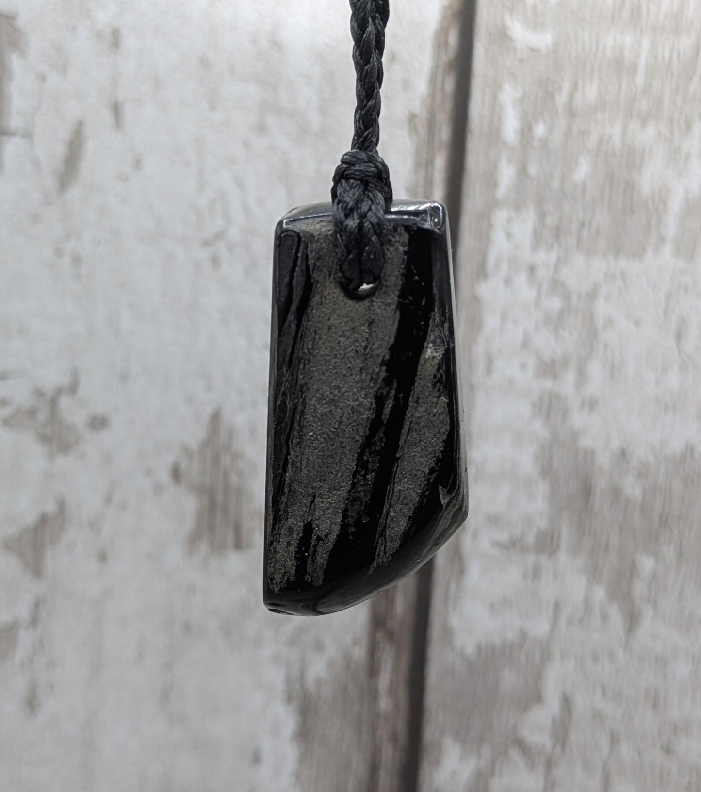 Whitby jet mixed textured polished pendant.