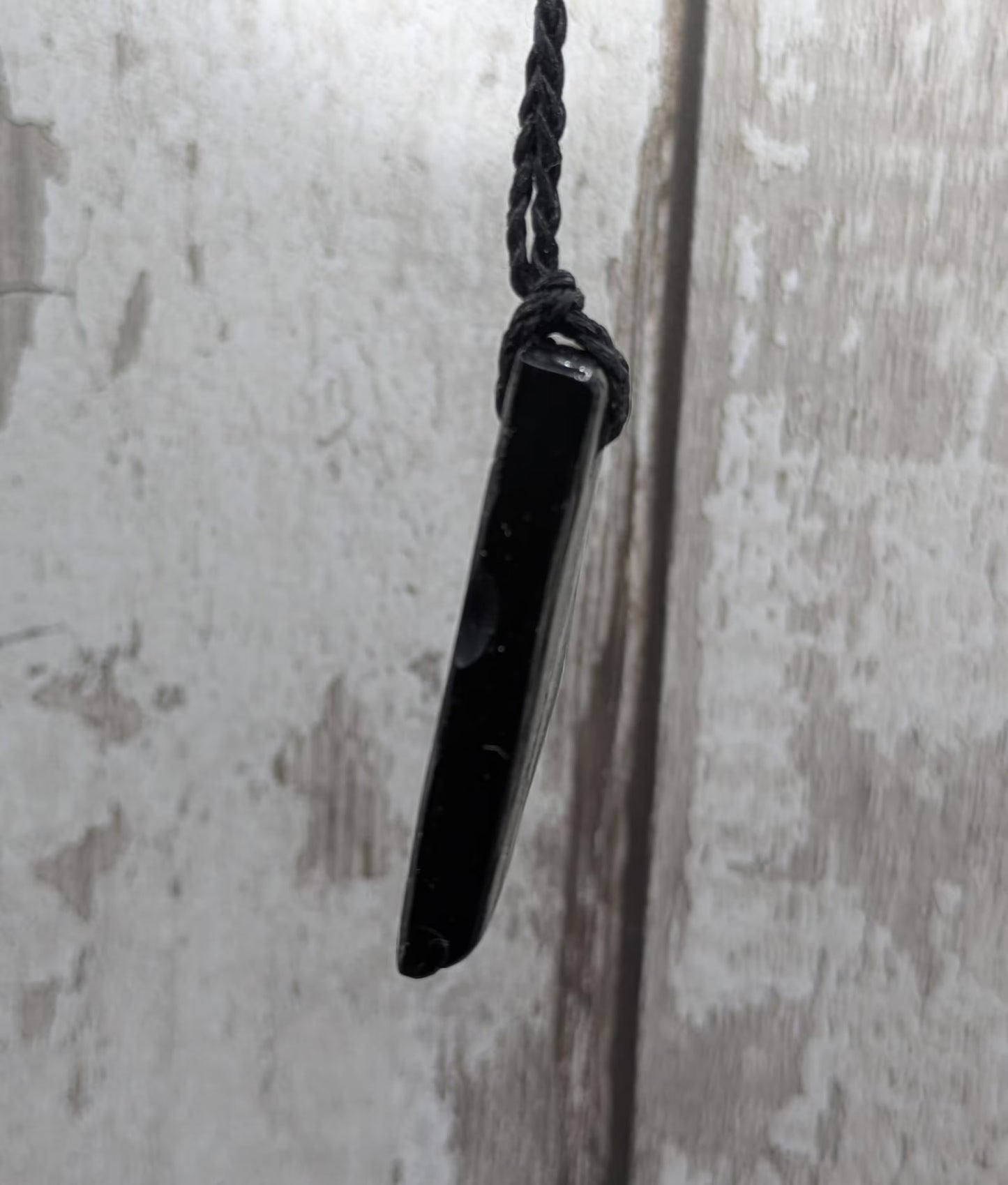Whitby jet mixed textured polished pendant.