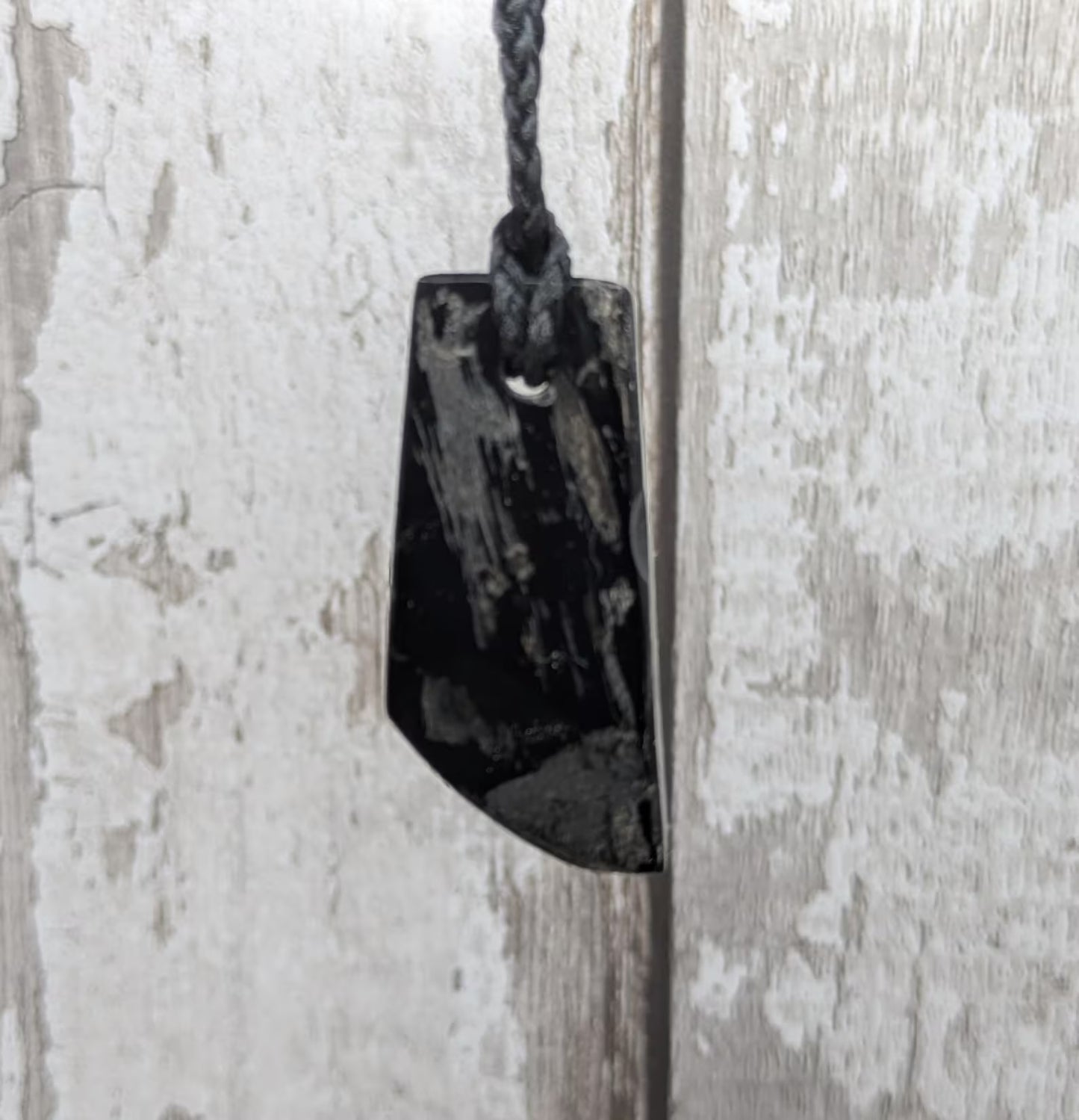 Whitby jet mixed textured polished pendant.