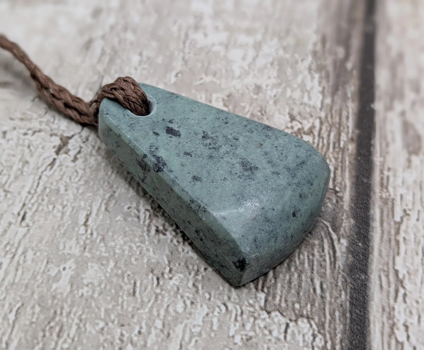 New Zealand pounamu greenstone jade her toki adze style pendant.