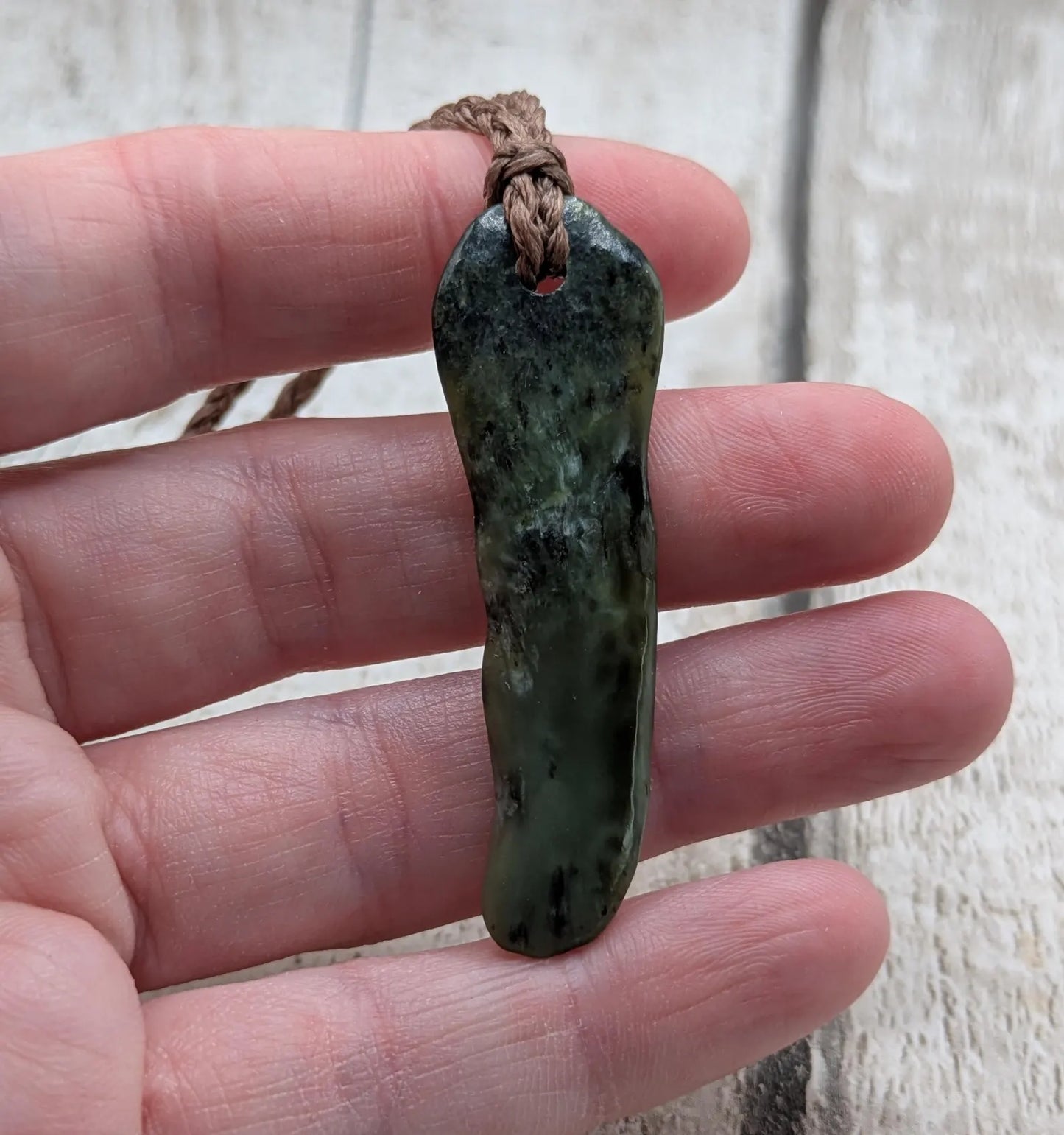 New Zealand Pounamu greenstone tumbled pendant.