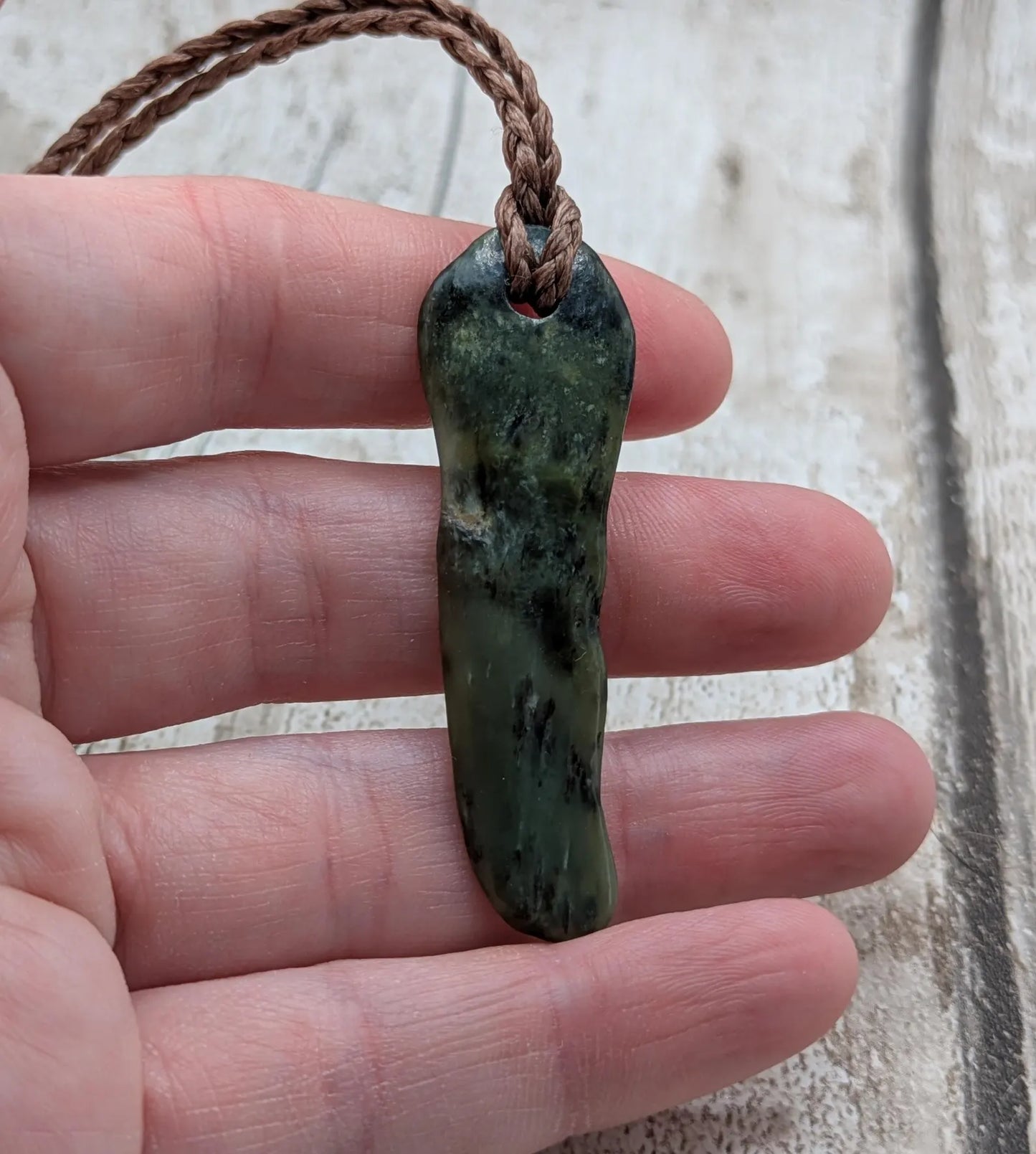 New Zealand Pounamu greenstone tumbled pendant.