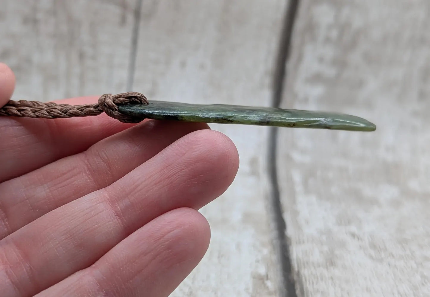 New Zealand Pounamu greenstone tumbled pendant.