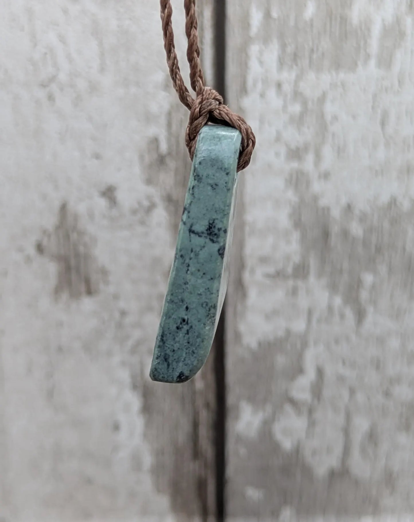 New Zealand pounamu greenstone jade her toki adze style pendant.