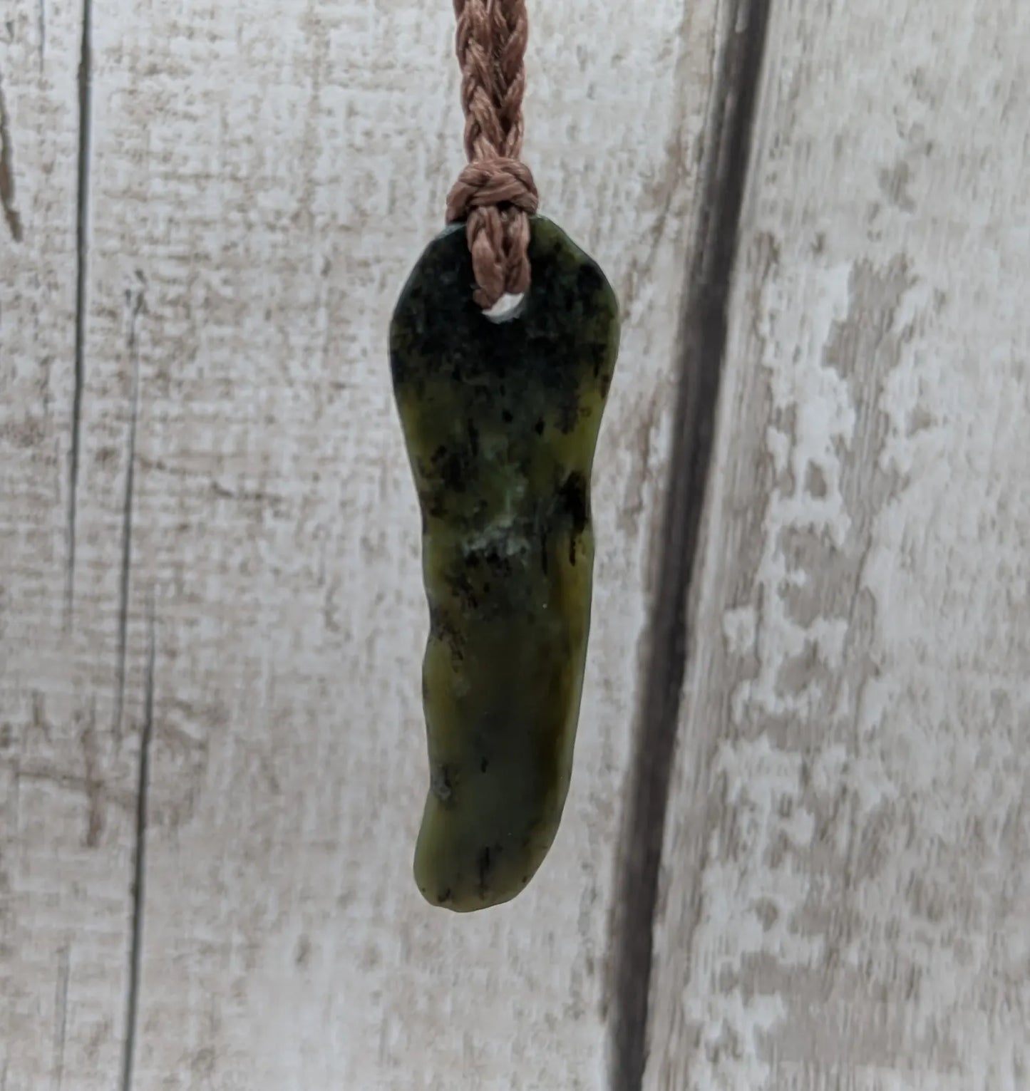 New Zealand Pounamu greenstone tumbled pendant.