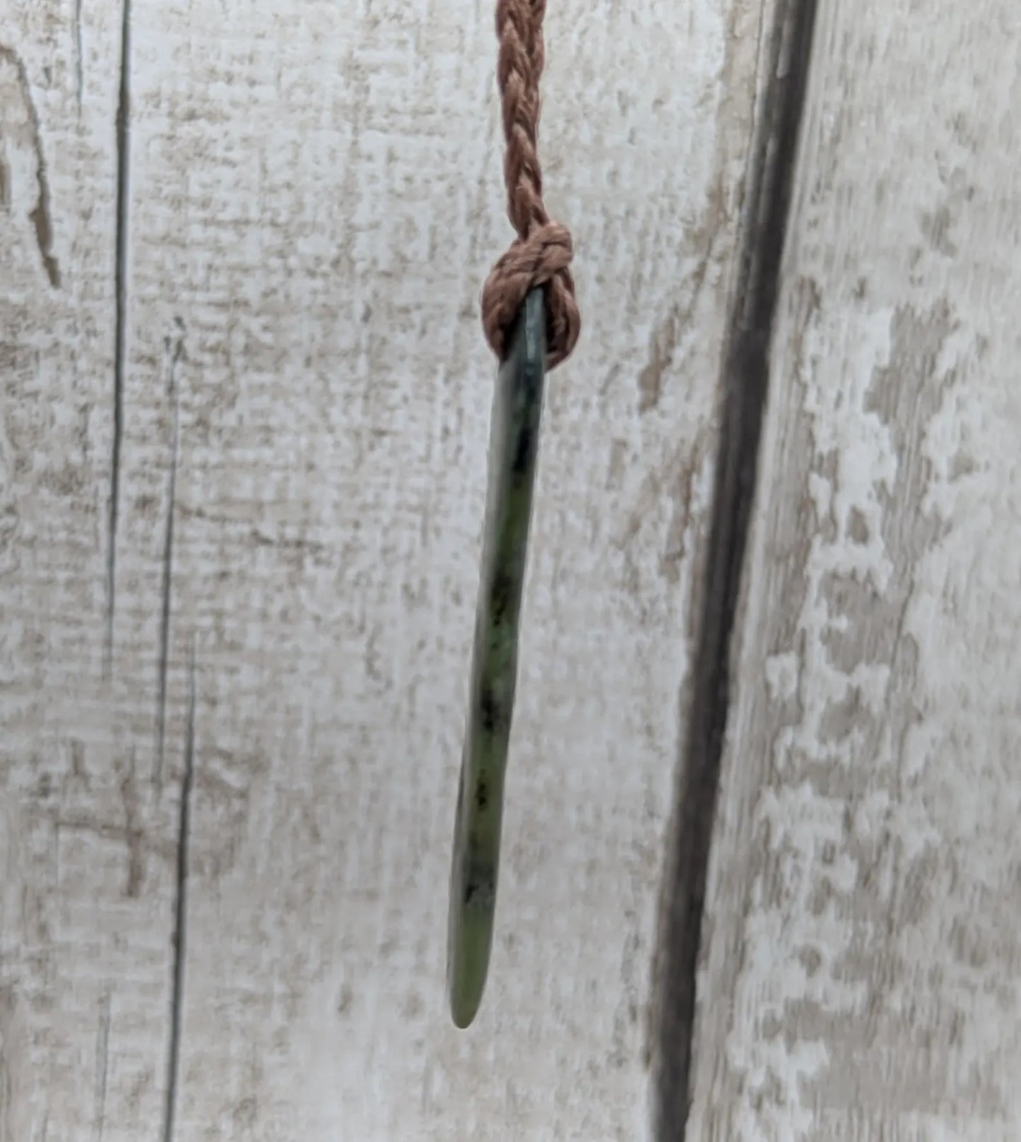 New Zealand Pounamu greenstone tumbled pendant.