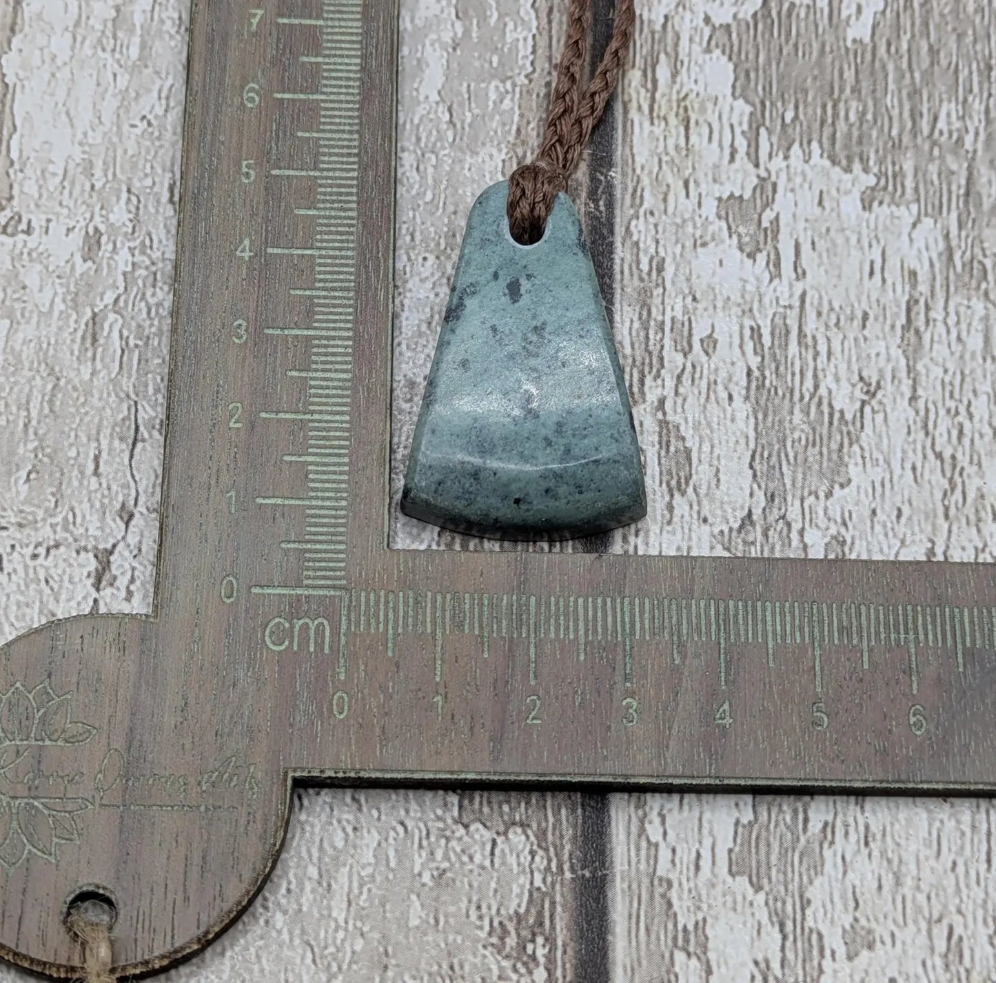 New Zealand pounamu greenstone jade her toki adze style pendant.