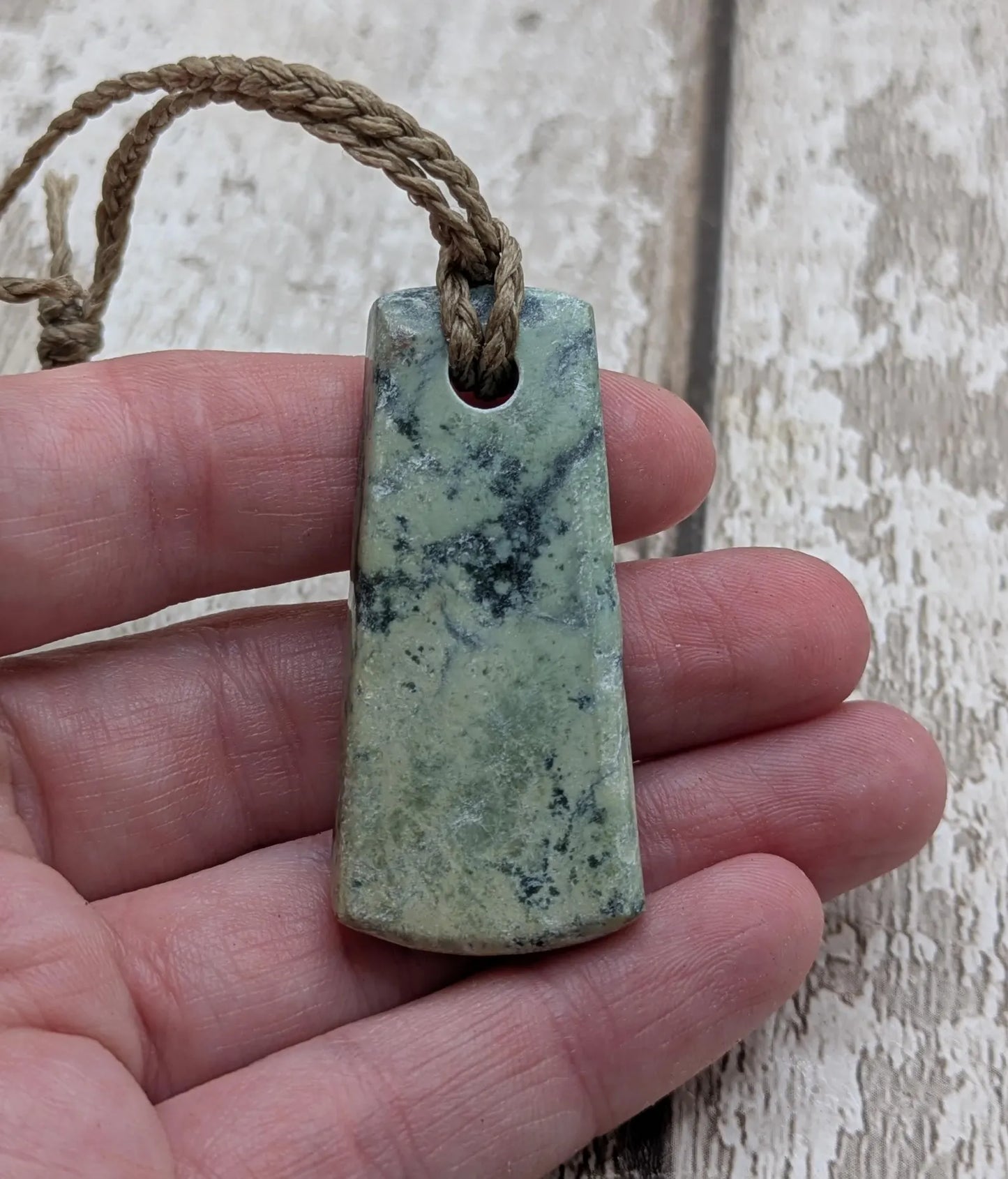 New Zealand pounamu greenstone jade hei toki adze pendant.