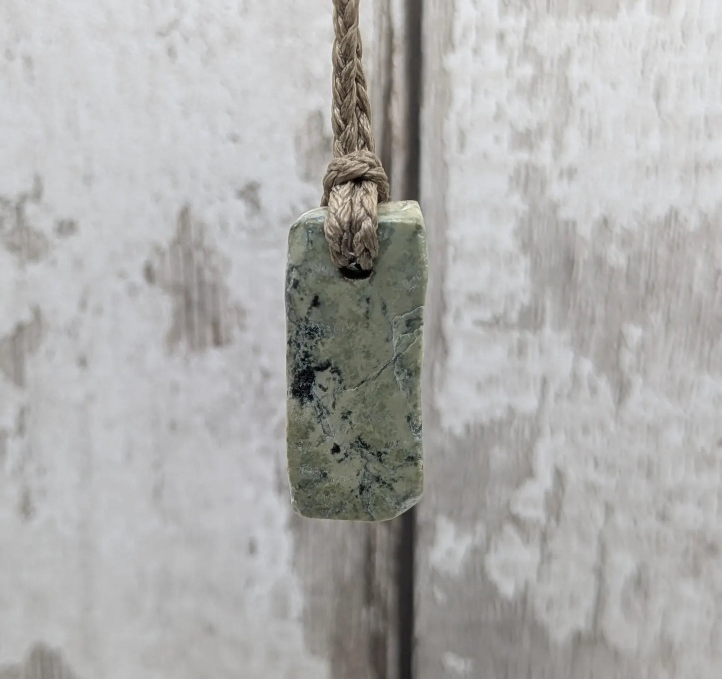 New Zealand pounamu greenstone jade slice with raw back.