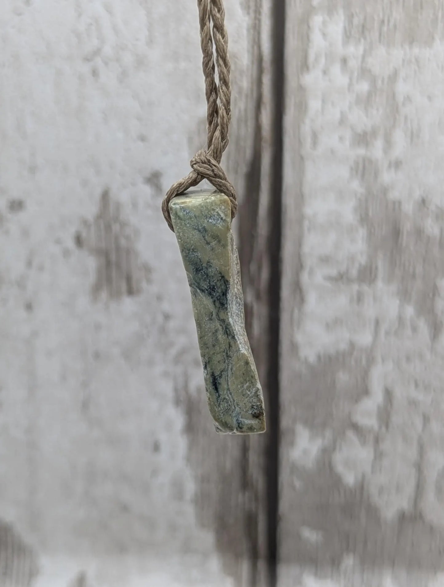 New Zealand pounamu greenstone jade slice with raw back.
