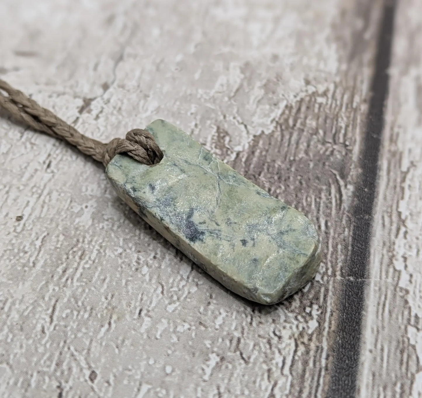 New Zealand pounamu greenstone jade slice with raw back.
