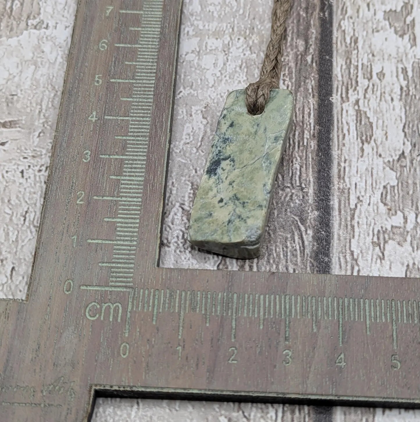 New Zealand pounamu greenstone jade slice with raw back.