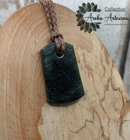 New Zealand Pounamu greenstone slice pendant.