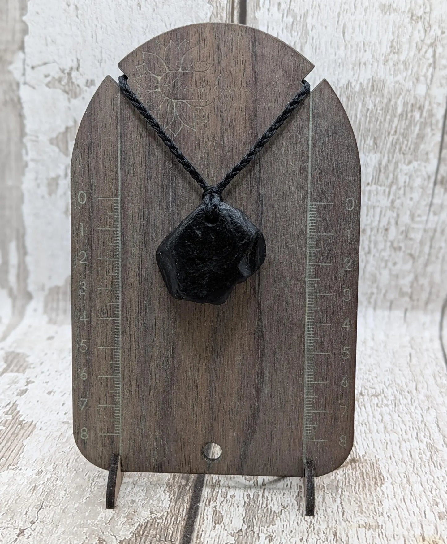 Raw naturally tumbled Whitby jet simple pendant.