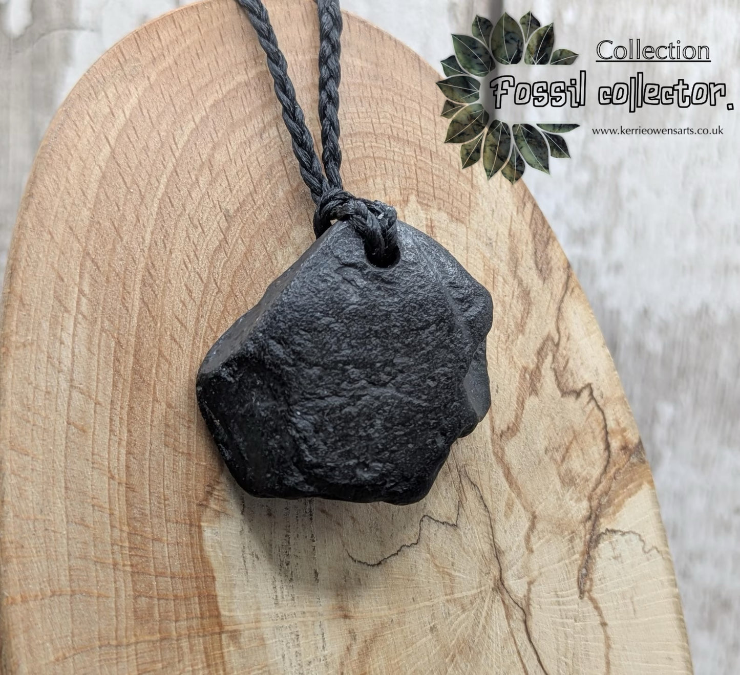 Raw naturally tumbled Whitby jet simple pendant.