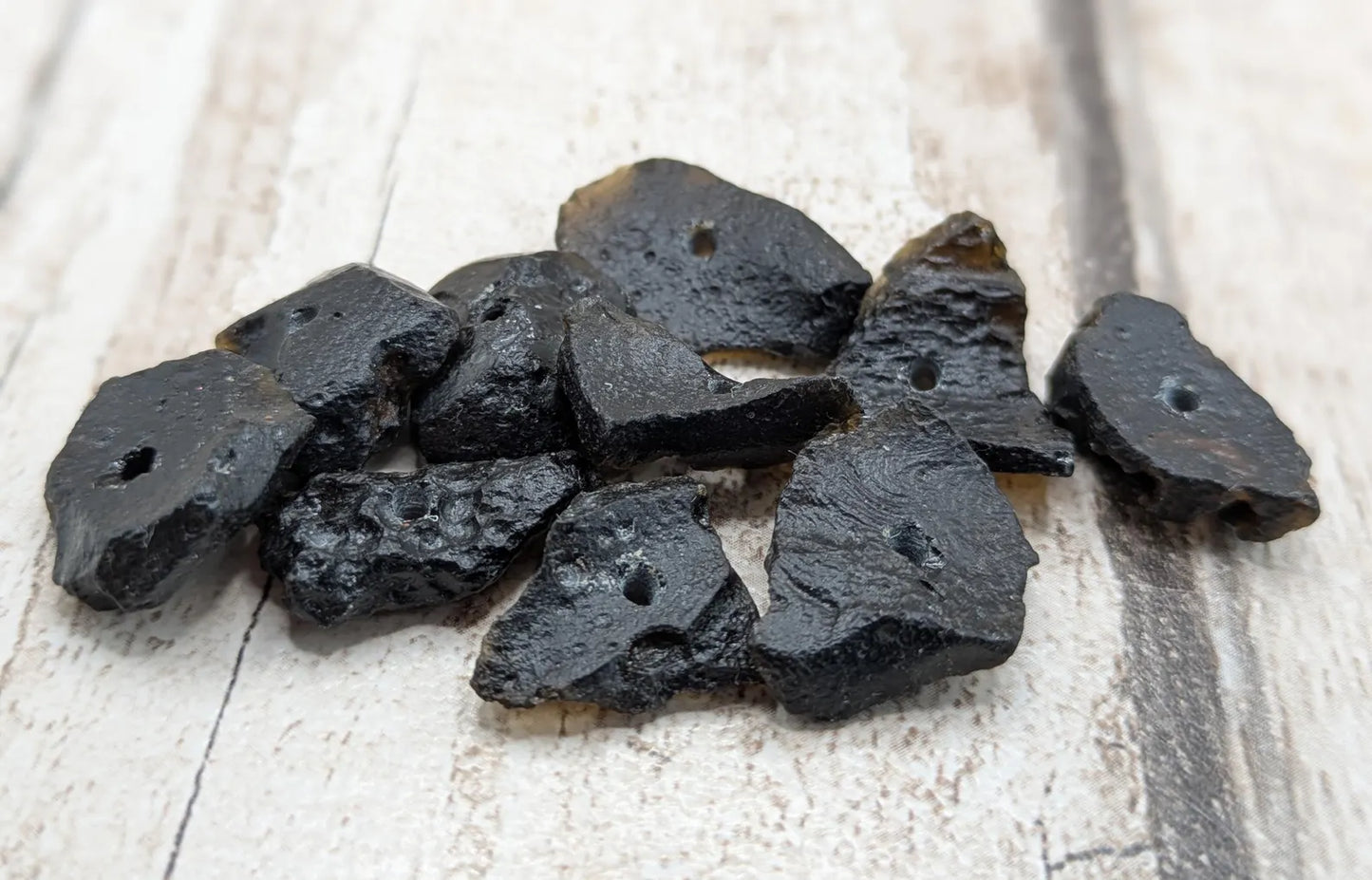10 Indonesian tektite glass beads.