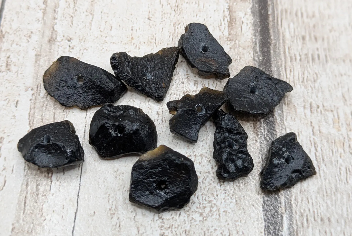 10 Indonesian tektite glass beads.