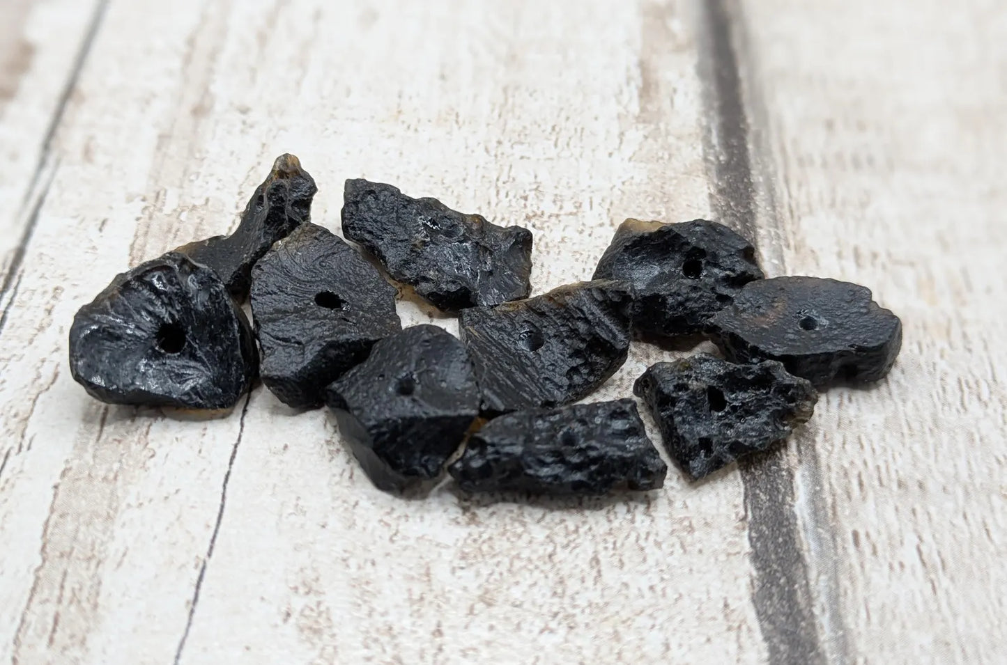10 Indonesian tektite glass beads.