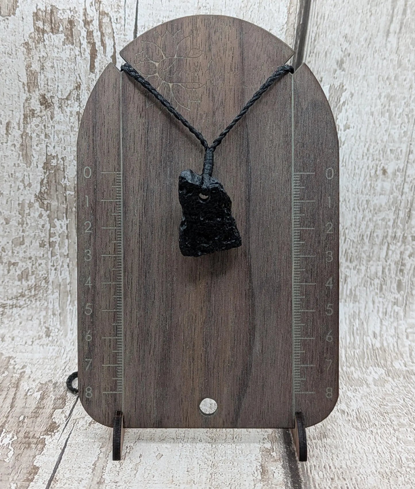 One Indonesian meteorite impact tektite glass pendant.