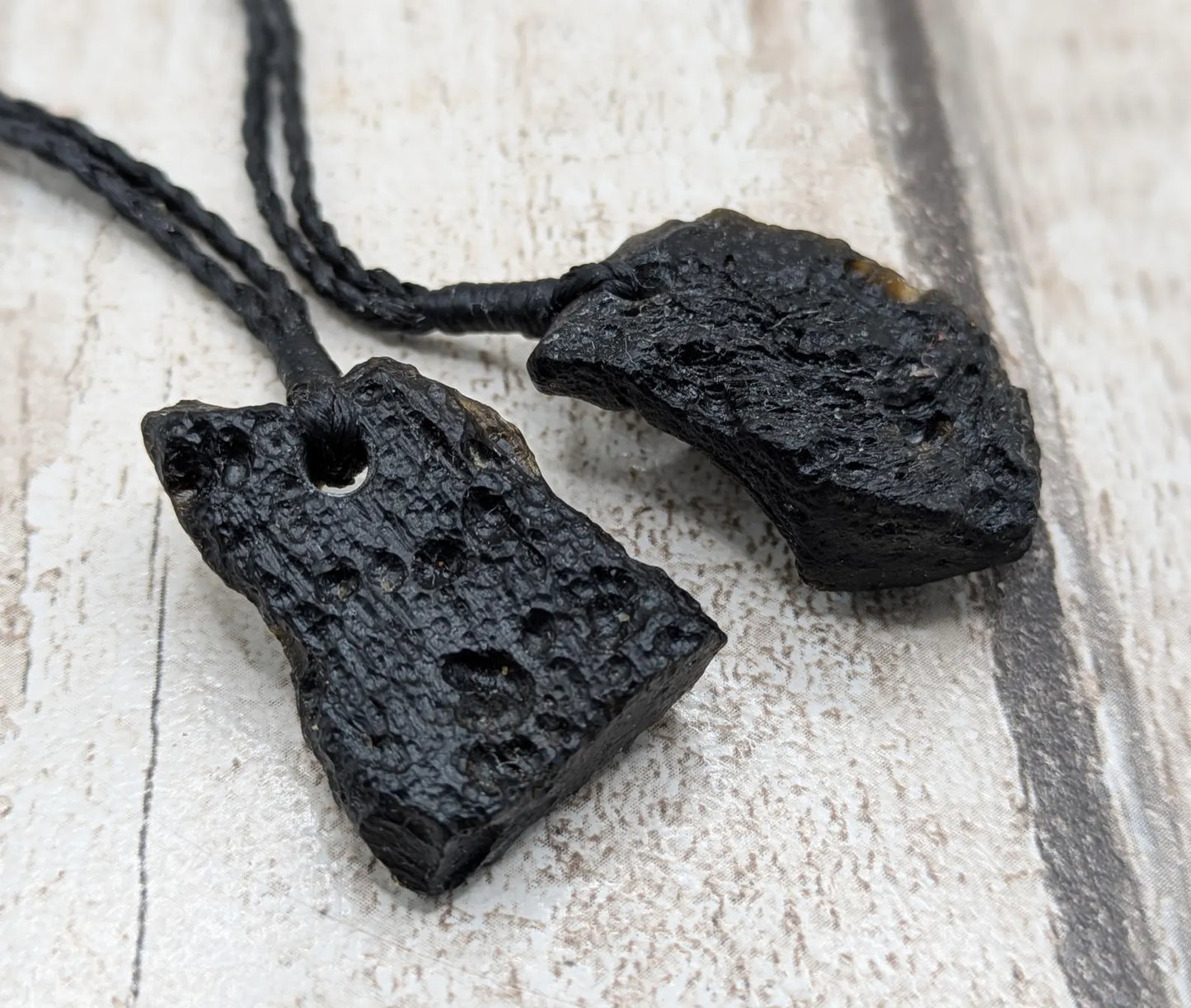 One Indonesian meteorite impact tektite glass pendant.