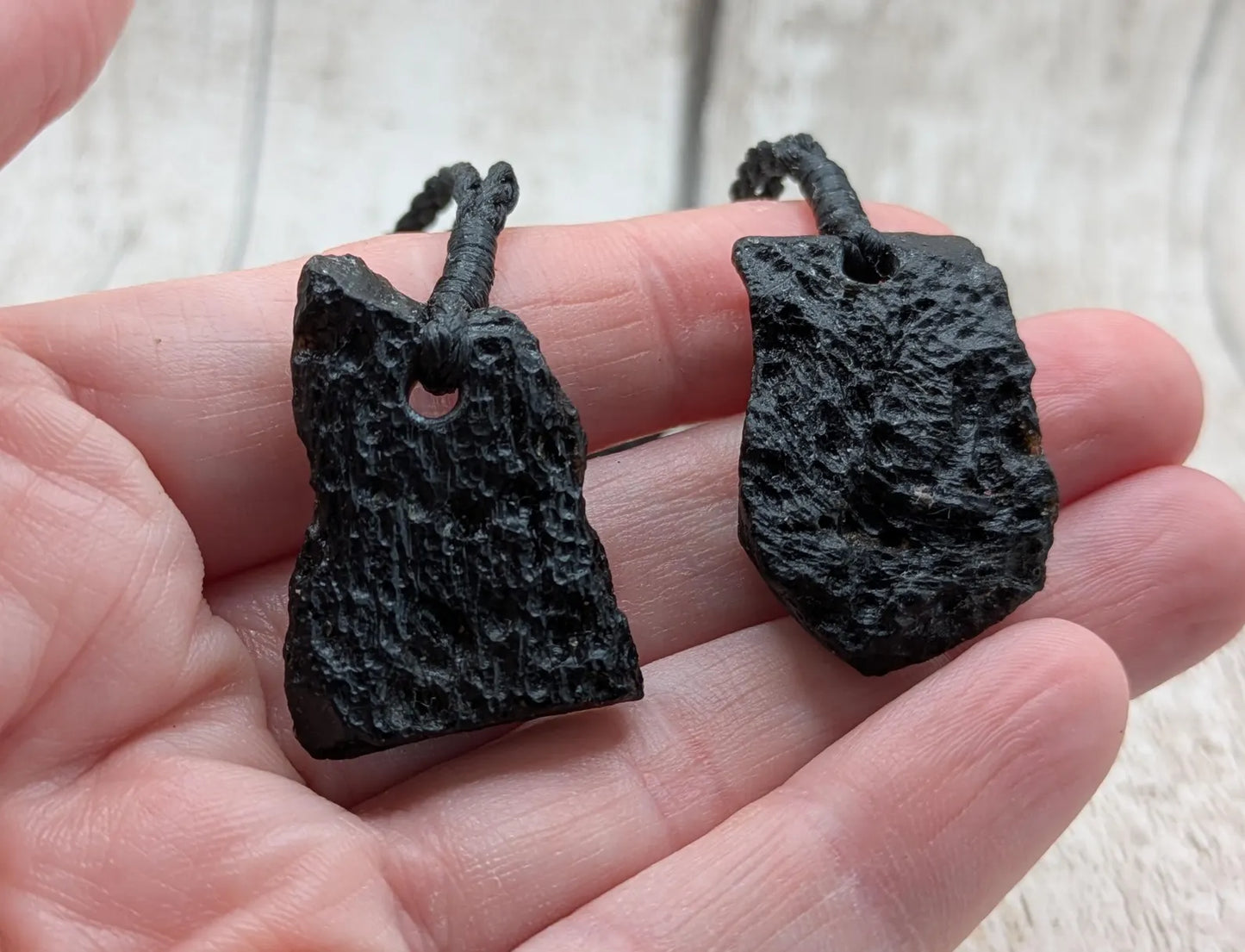 One Indonesian meteorite impact tektite glass pendant.