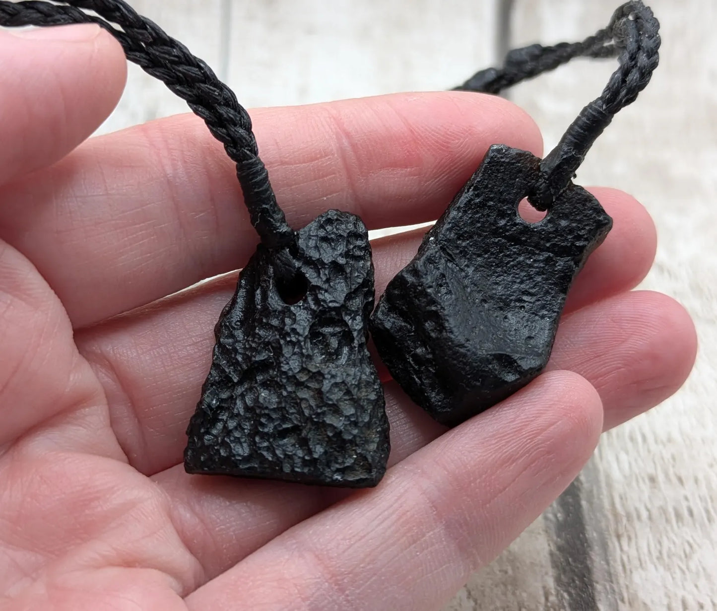One Indonesian meteorite impact tektite glass pendant.