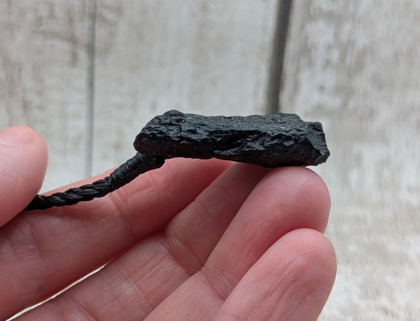 One Indonesian meteorite impact tektite glass pendant.