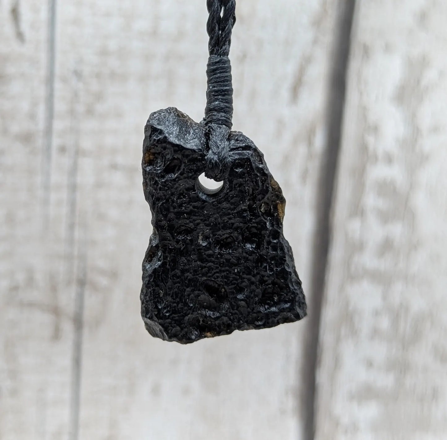 One Indonesian meteorite impact tektite glass pendant.