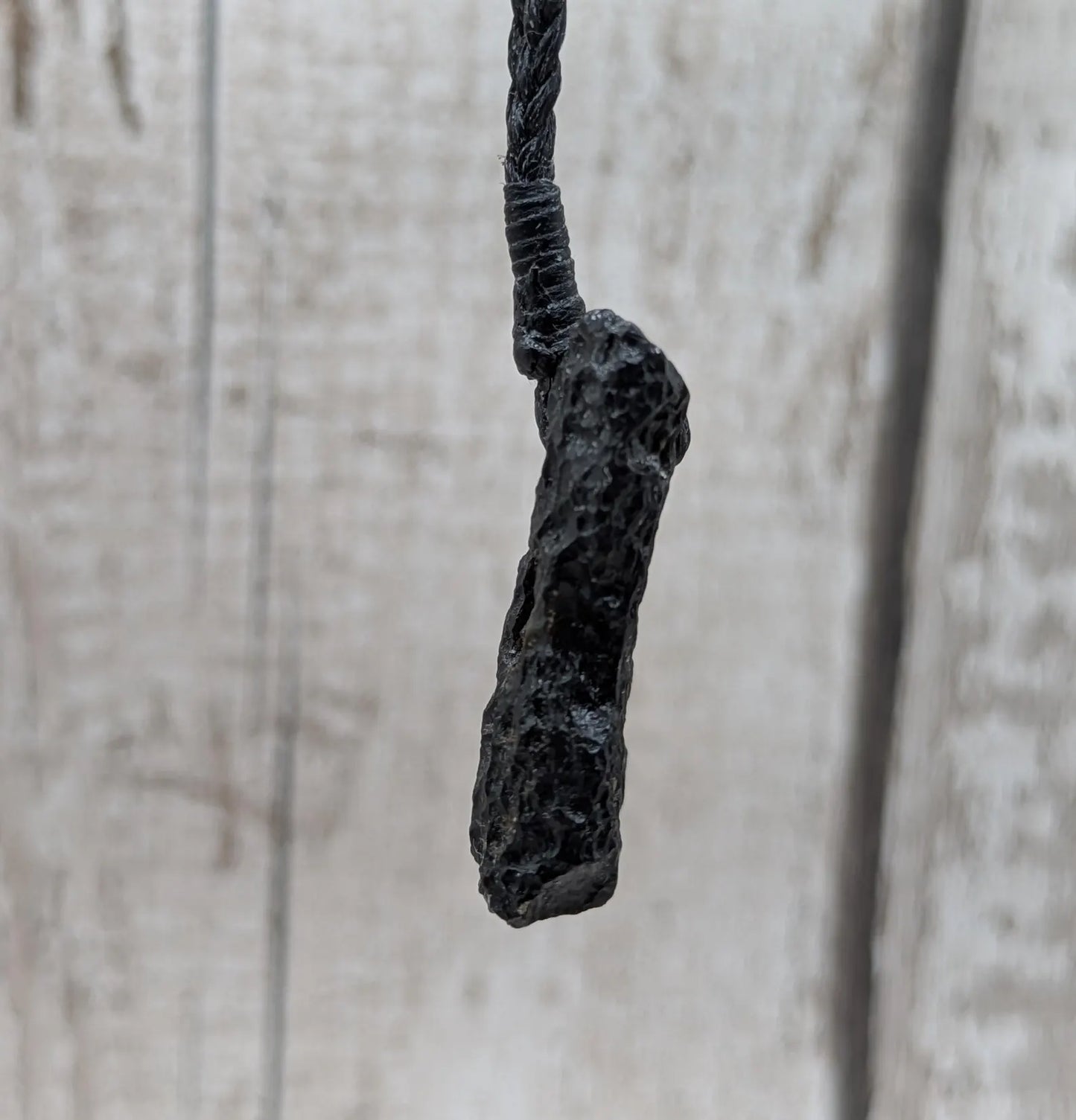 One Indonesian meteorite impact tektite glass pendant.