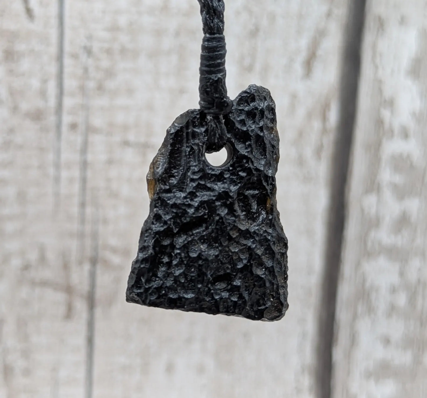 One Indonesian meteorite impact tektite glass pendant.