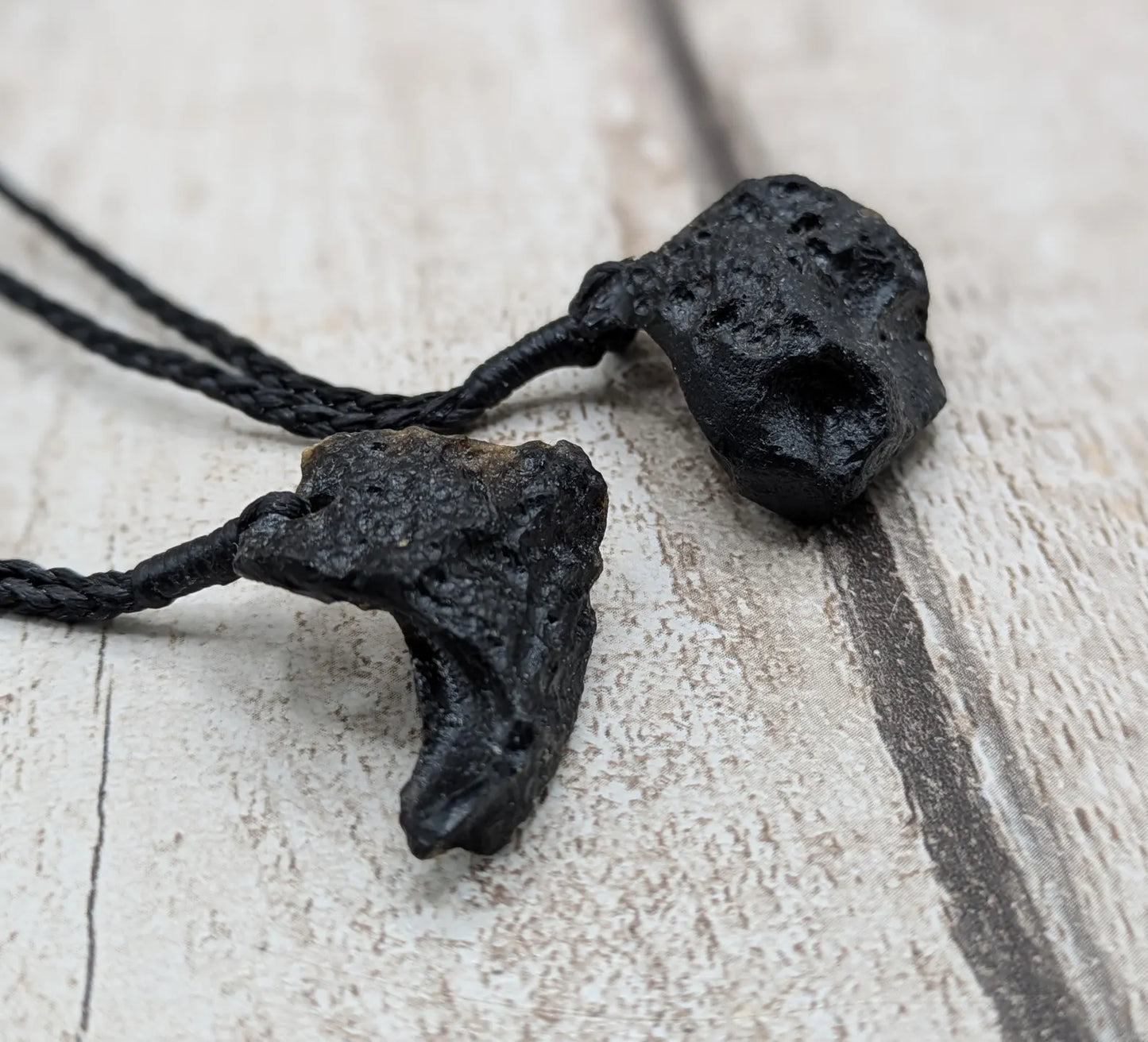One Indonesian meteorite tektite impact glass pendant.