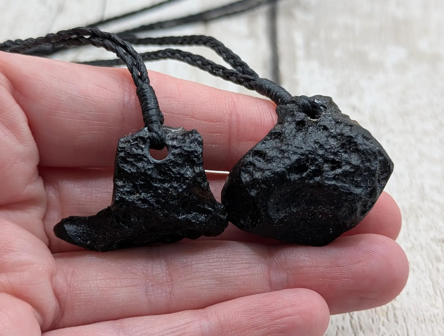 One Indonesian meteorite tektite impact glass pendant.