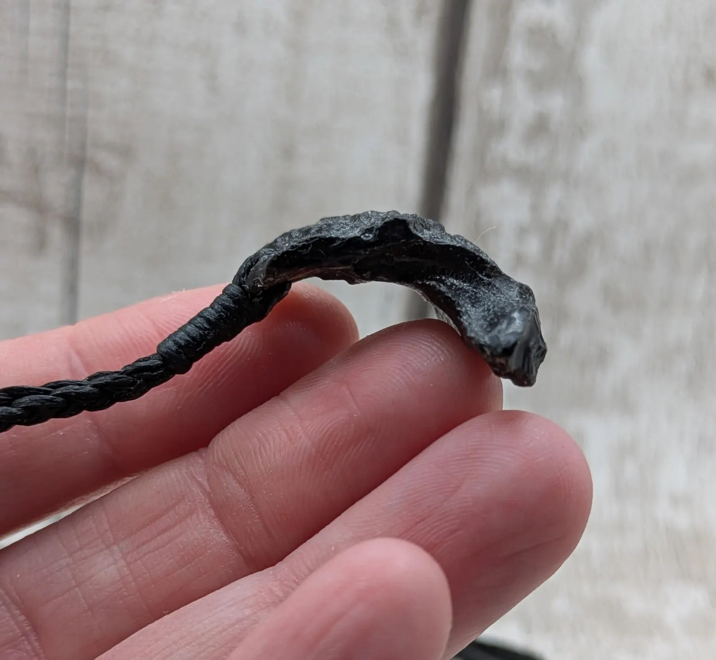 One Indonesian meteorite tektite impact glass pendant.