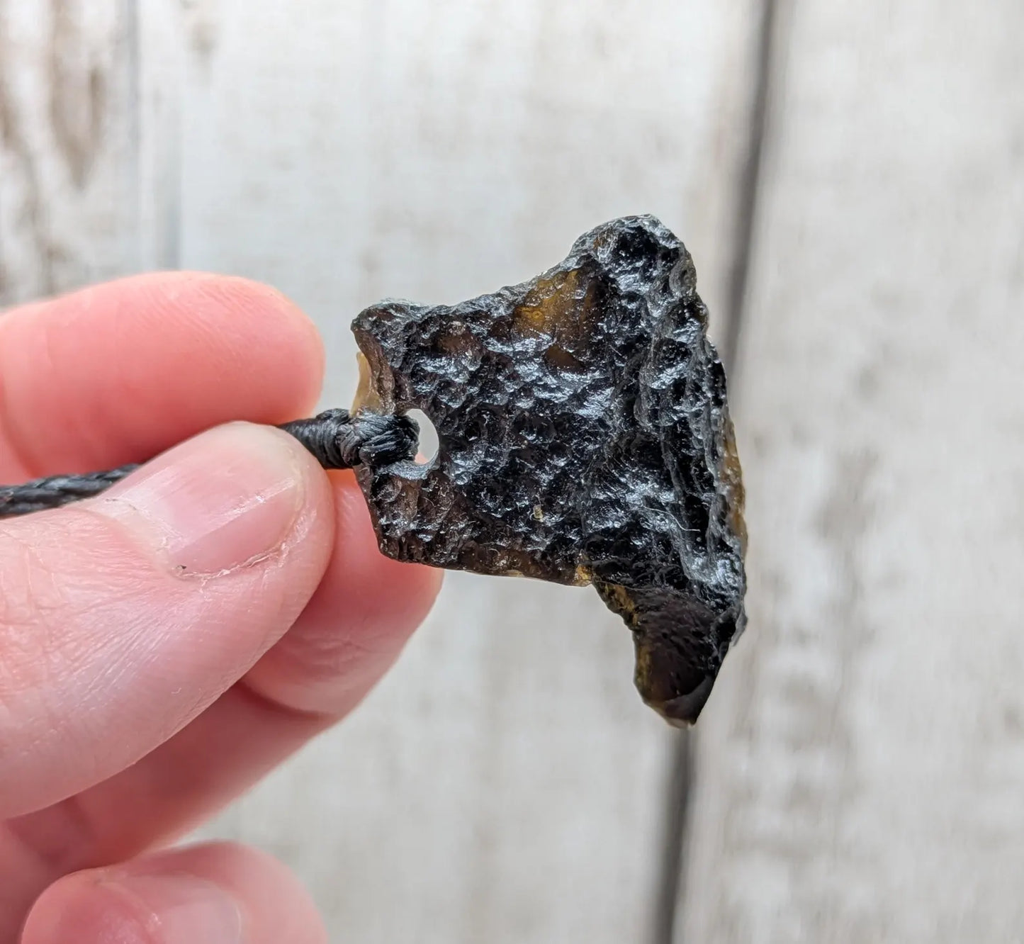 One Indonesian meteorite tektite impact glass pendant.