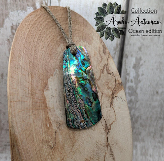 New Zealand Rainbow pāua shell pendant - iridescent abalone necklace, trapezoid shape, oceanic gift, hand crafted jewellery.