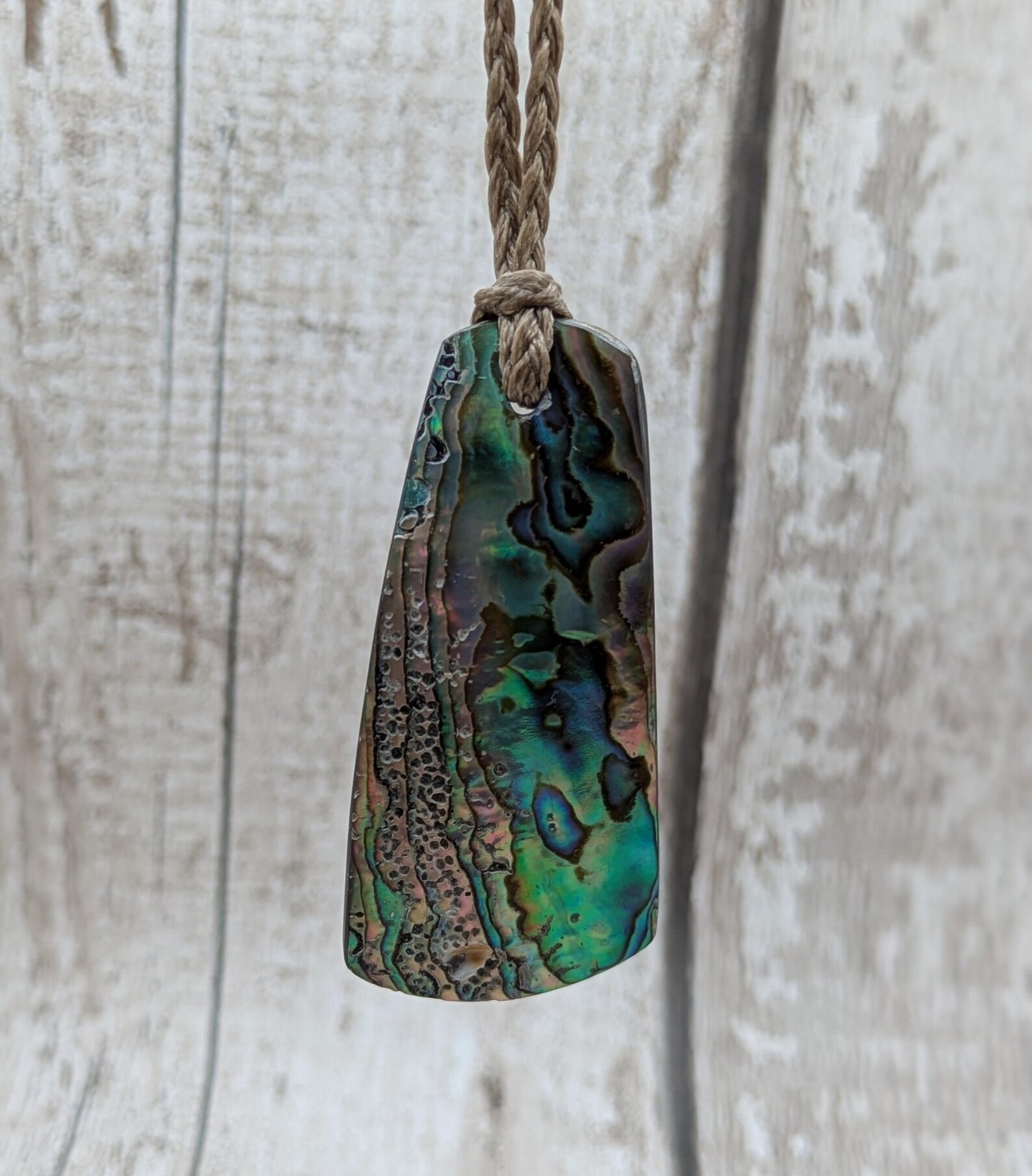 New Zealand Rainbow pāua shell pendant - iridescent abalone necklace, trapezoid shape, oceanic gift, hand crafted jewellery.