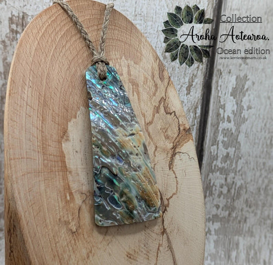 New Zealand Rainbow pāua shell pendant - iridescent abalone necklace, trapezoid shape, oceanic gift, hand crafted jewellery.