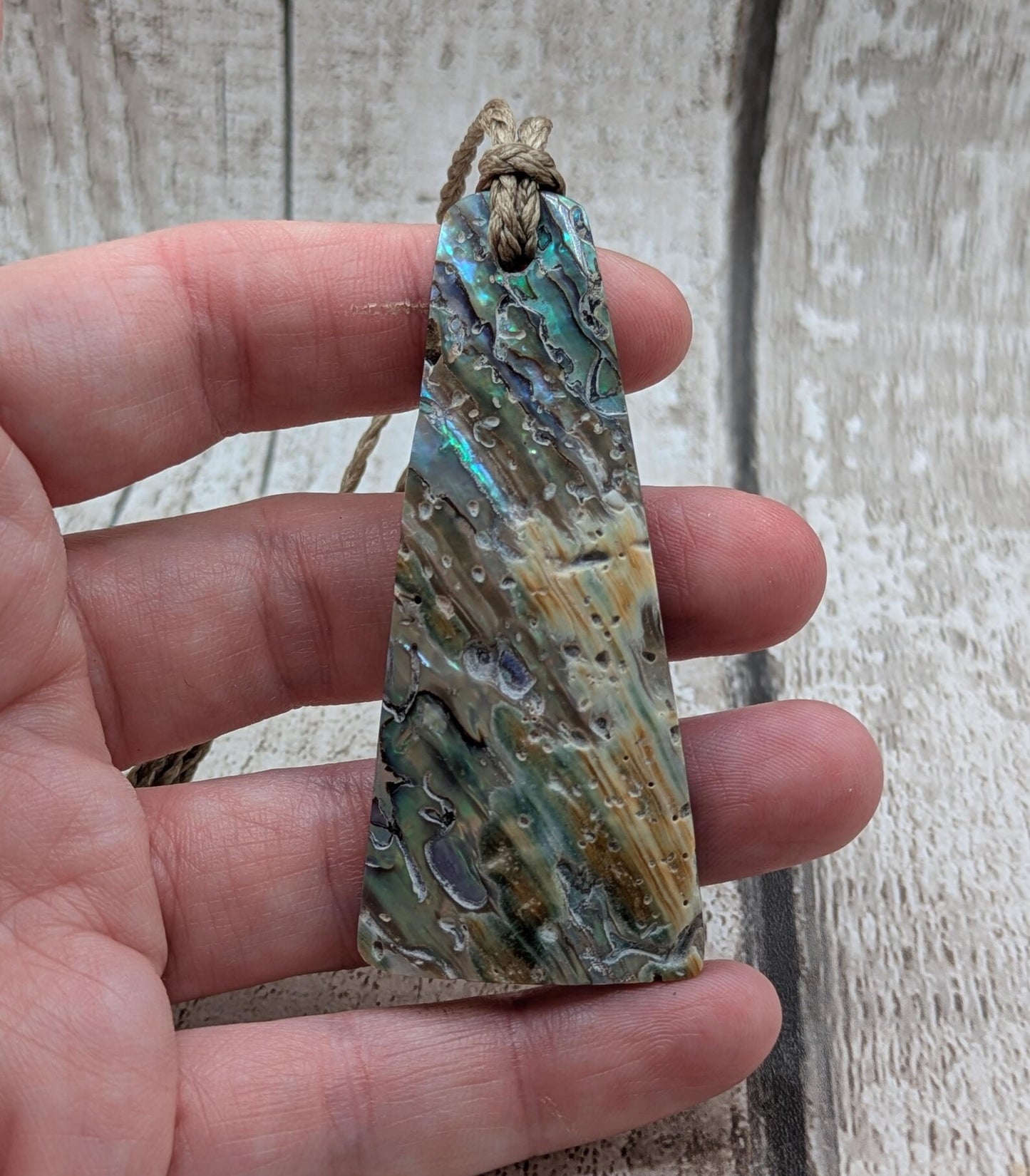 New Zealand Rainbow pāua shell pendant - iridescent abalone necklace, trapezoid shape, oceanic gift, hand crafted jewellery.