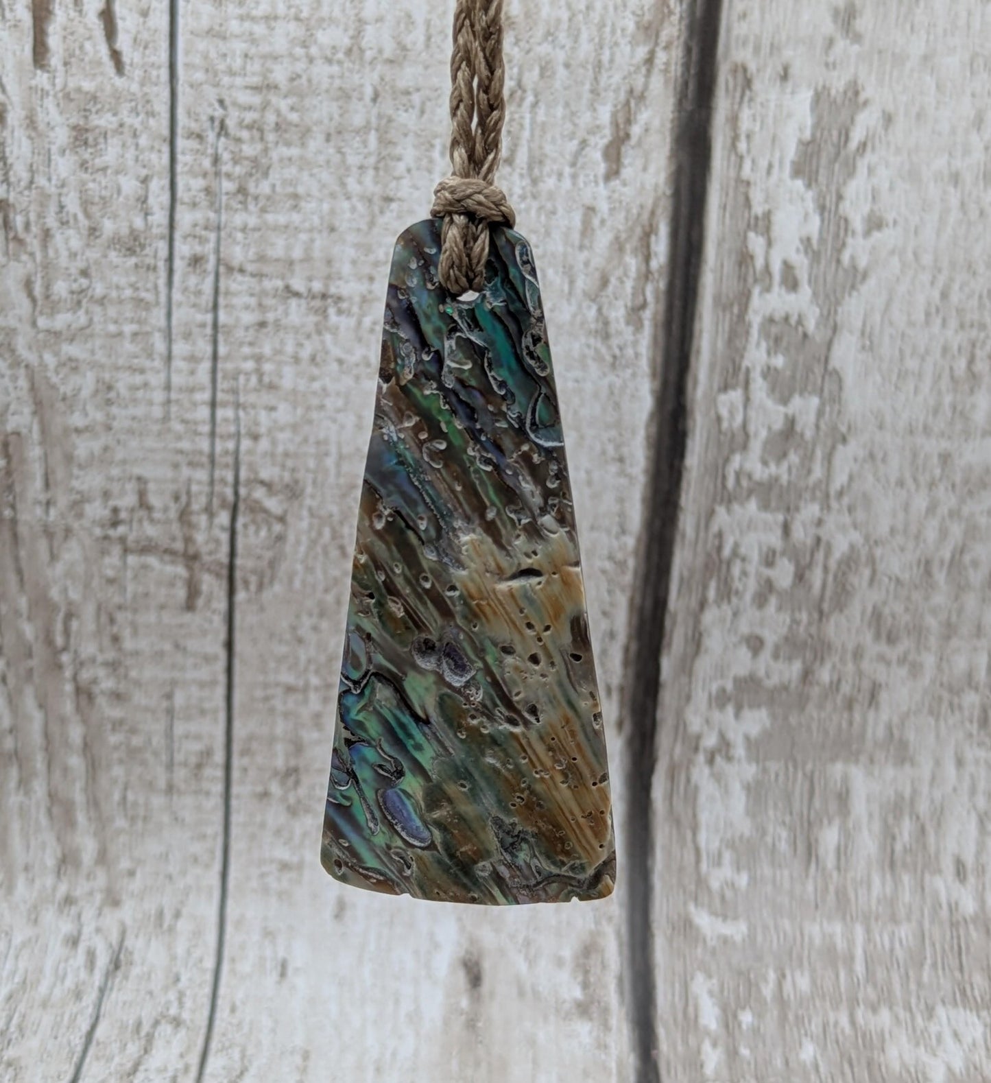 New Zealand Rainbow pāua shell pendant - iridescent abalone necklace, trapezoid shape, oceanic gift, hand crafted jewellery.
