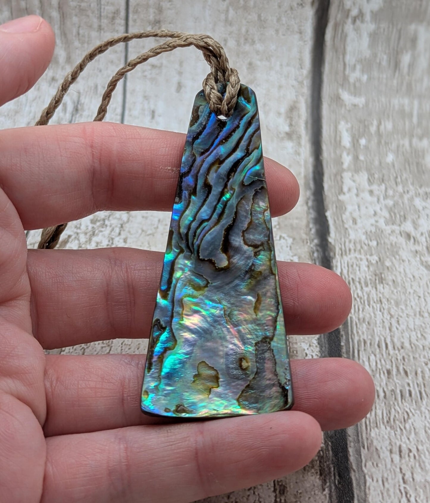 New Zealand Rainbow pāua shell pendant - iridescent abalone necklace, trapezoid shape, oceanic gift, hand crafted jewellery.