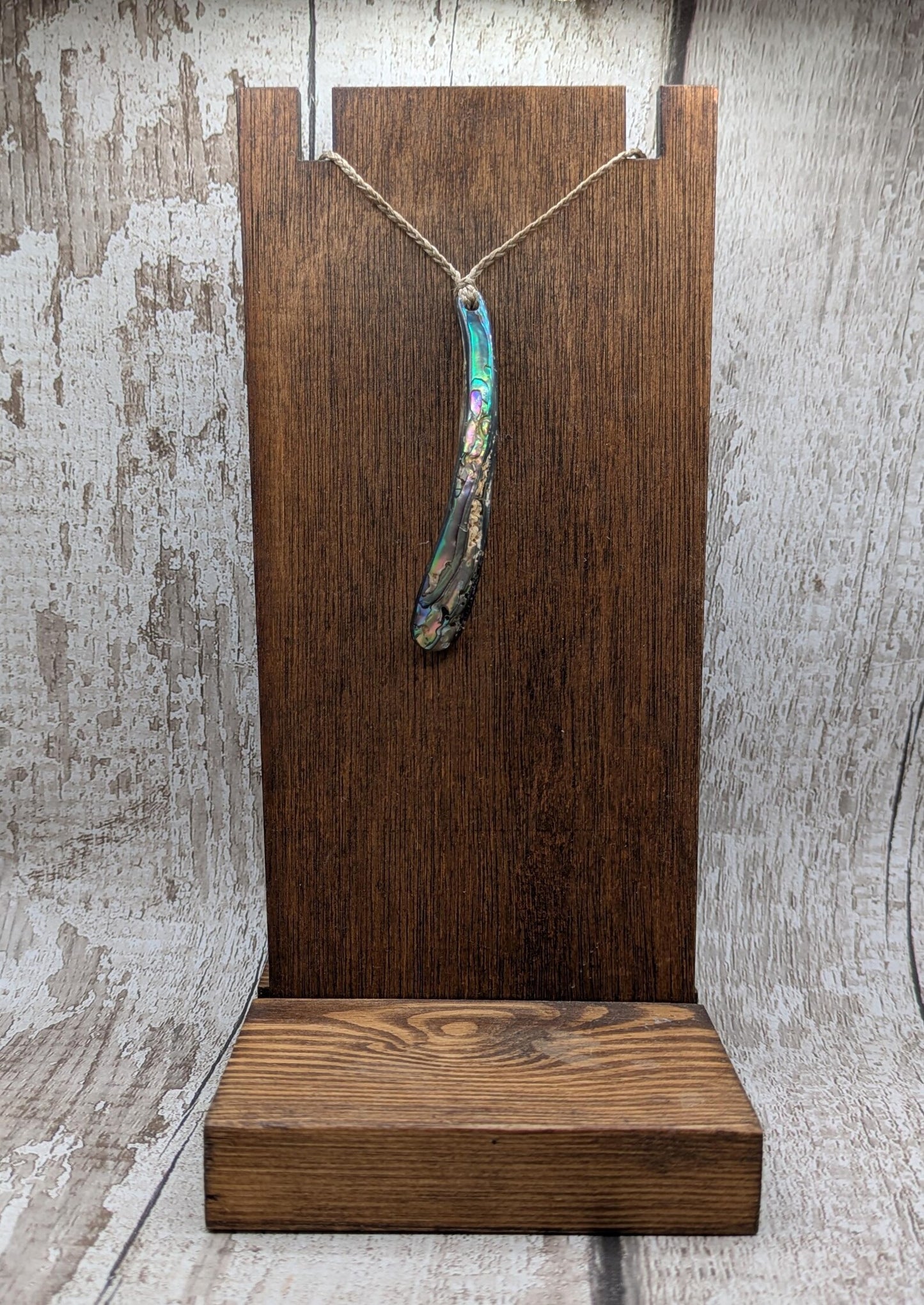 New Zealand rainbow pāua rim drop pendant.
