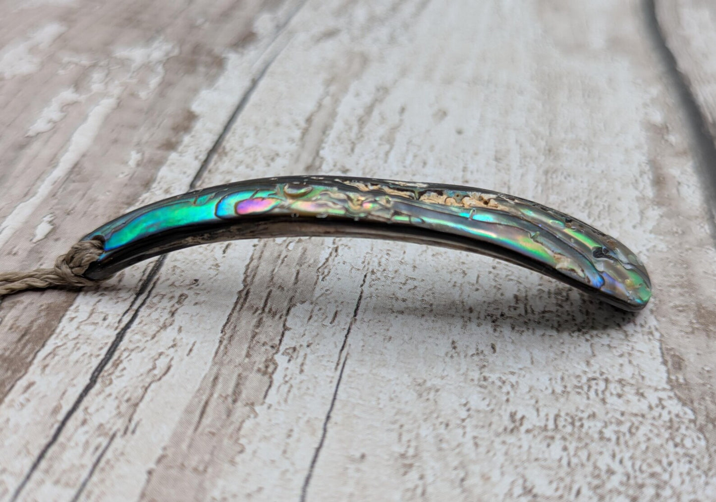 New Zealand rainbow pāua rim drop pendant.