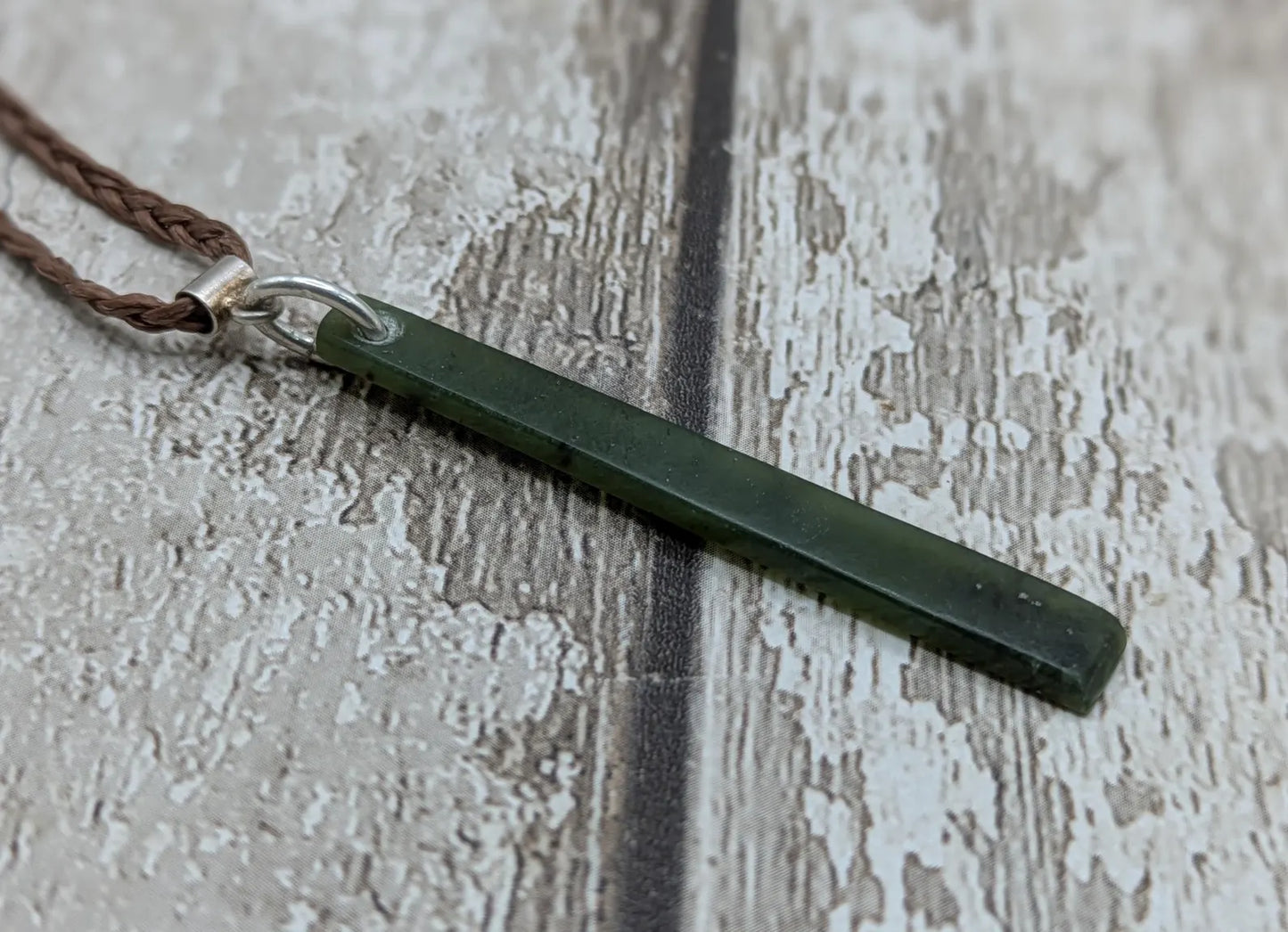 New Zealand pounamu nephrite jade greenstone thin Toki drop pendant. With silver bail.