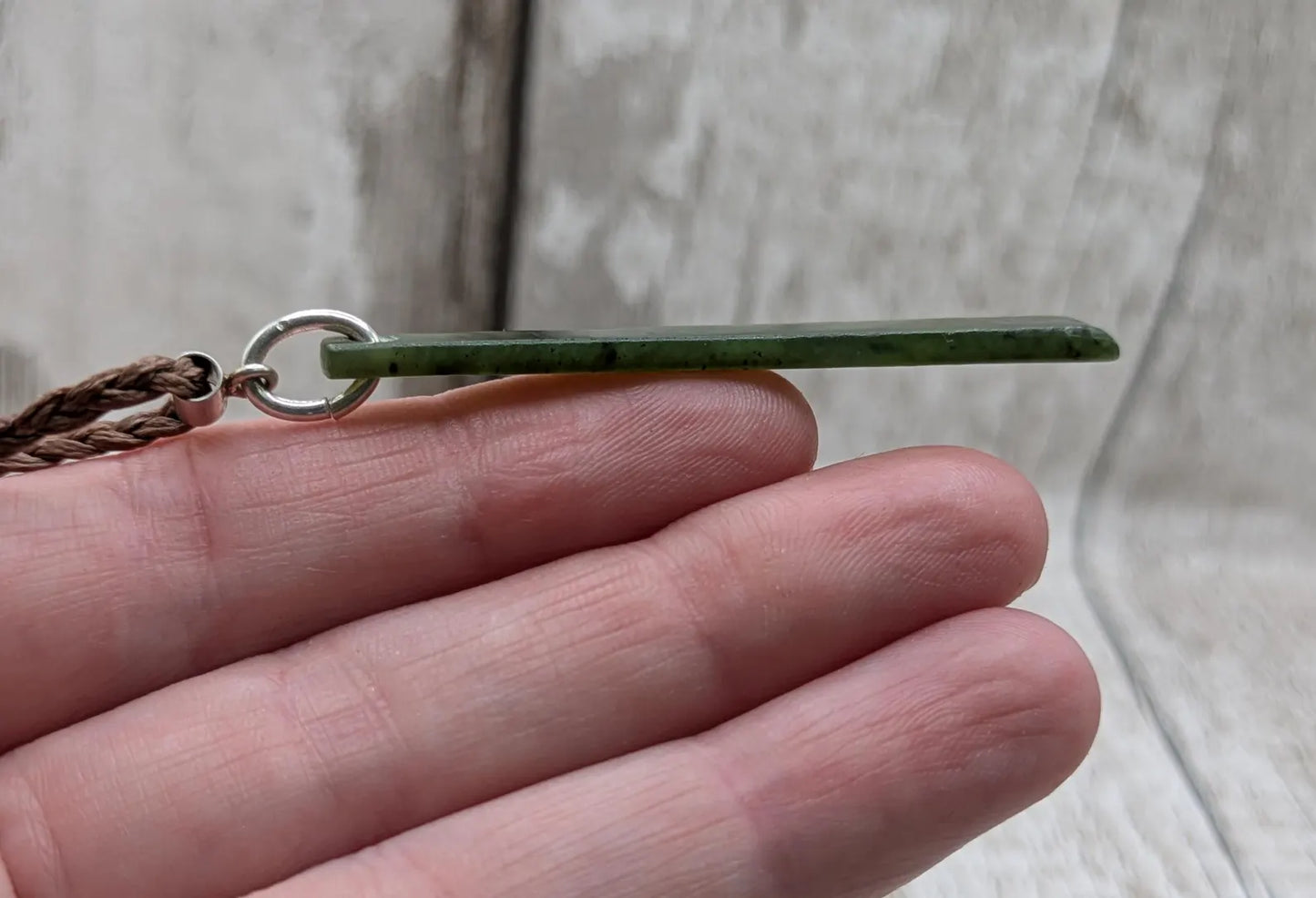 New Zealand pounamu nephrite jade greenstone thin Toki drop pendant. With silver bail.