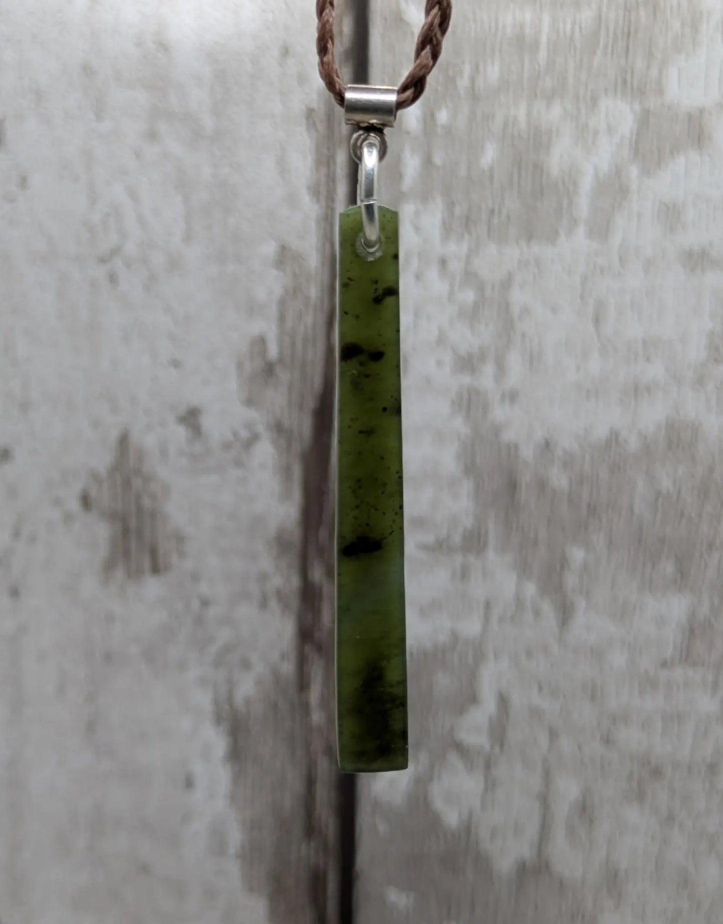 New Zealand pounamu nephrite jade greenstone thin Toki drop pendant. With silver bail.