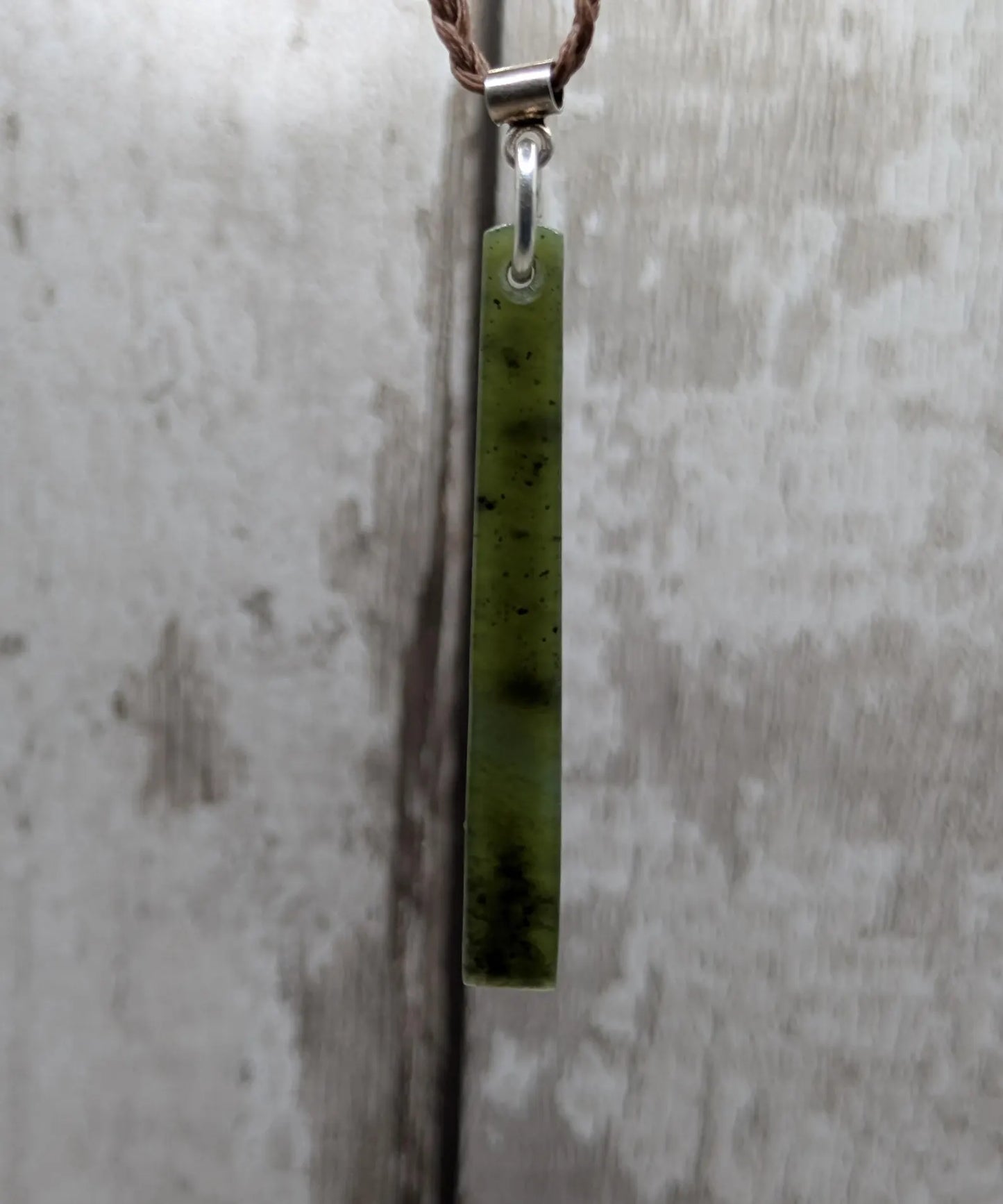 New Zealand pounamu nephrite jade greenstone thin Toki drop pendant. With silver bail.
