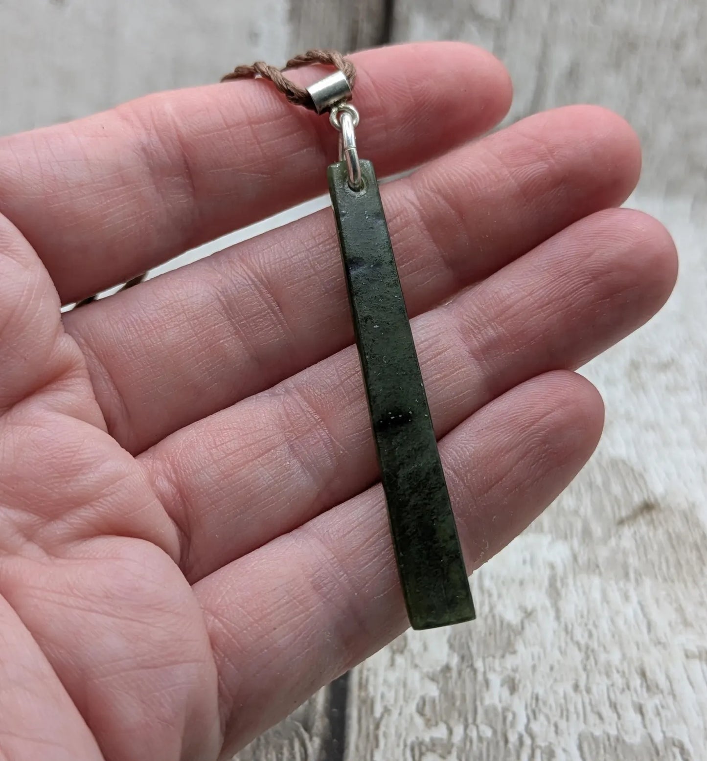 New Zealand pounamu nephrite jade greenstone thin Toki drop pendant. With silver bail.