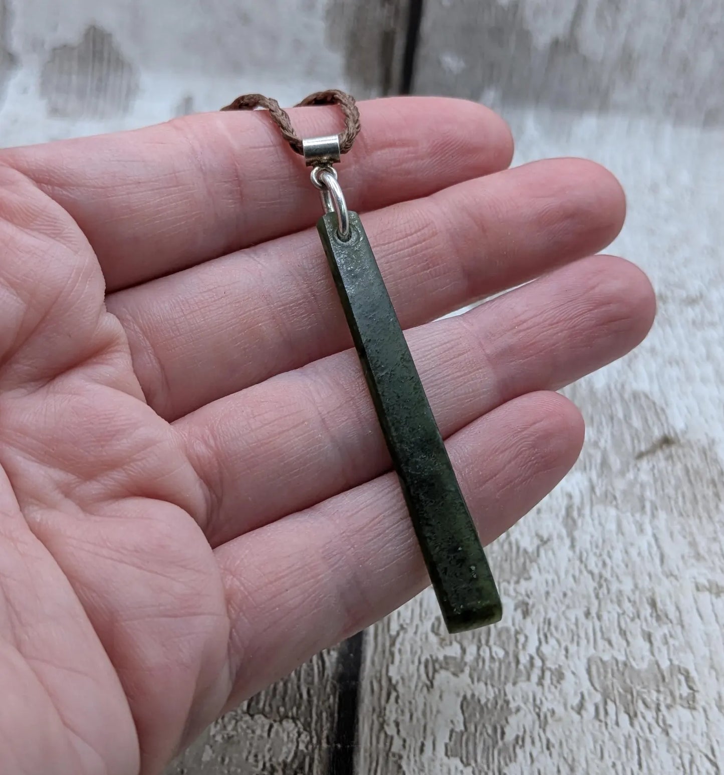 New Zealand pounamu nephrite jade greenstone thin Toki drop pendant. With silver bail.
