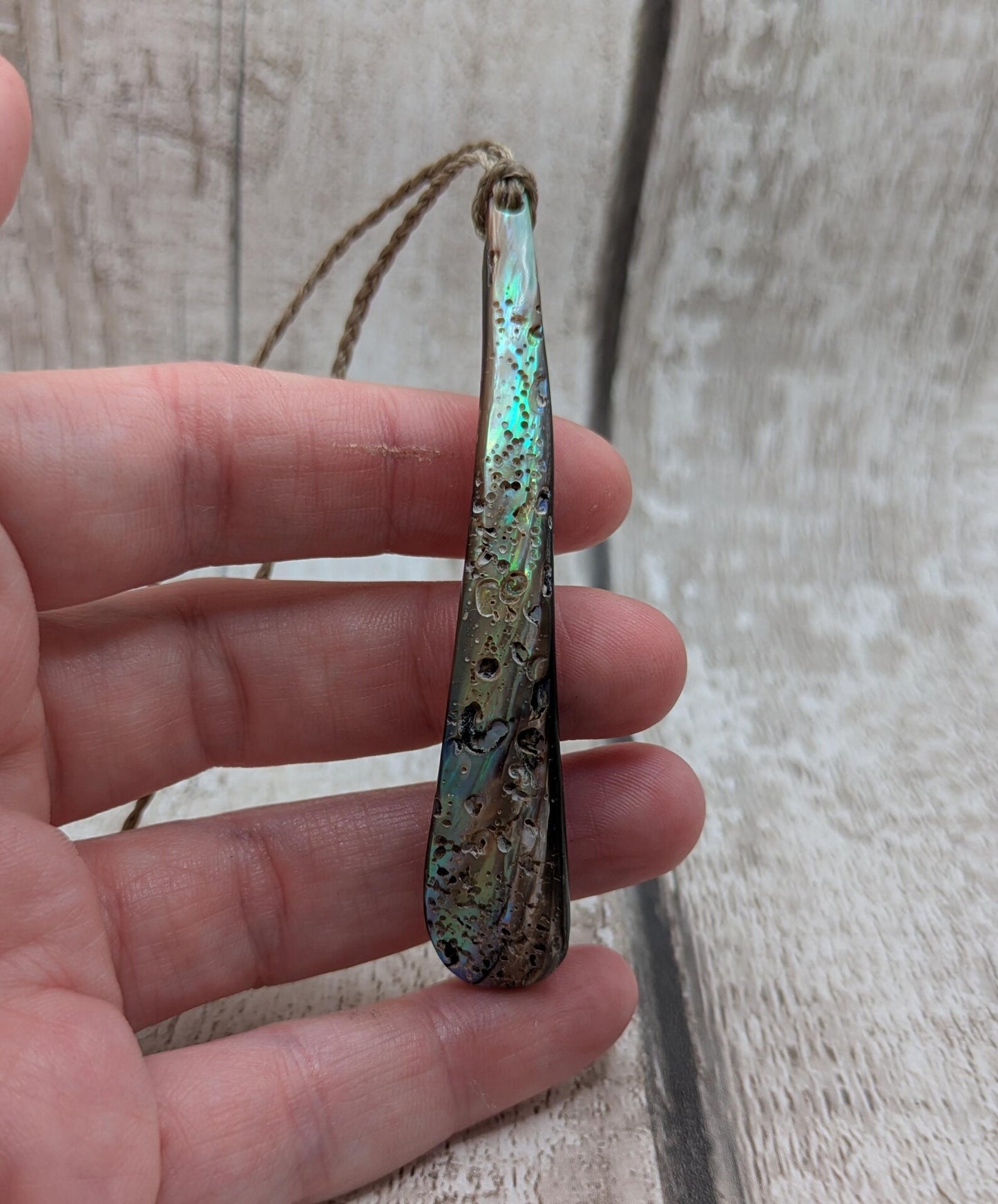 New Zealand rainbow pāua rim drop pendant.