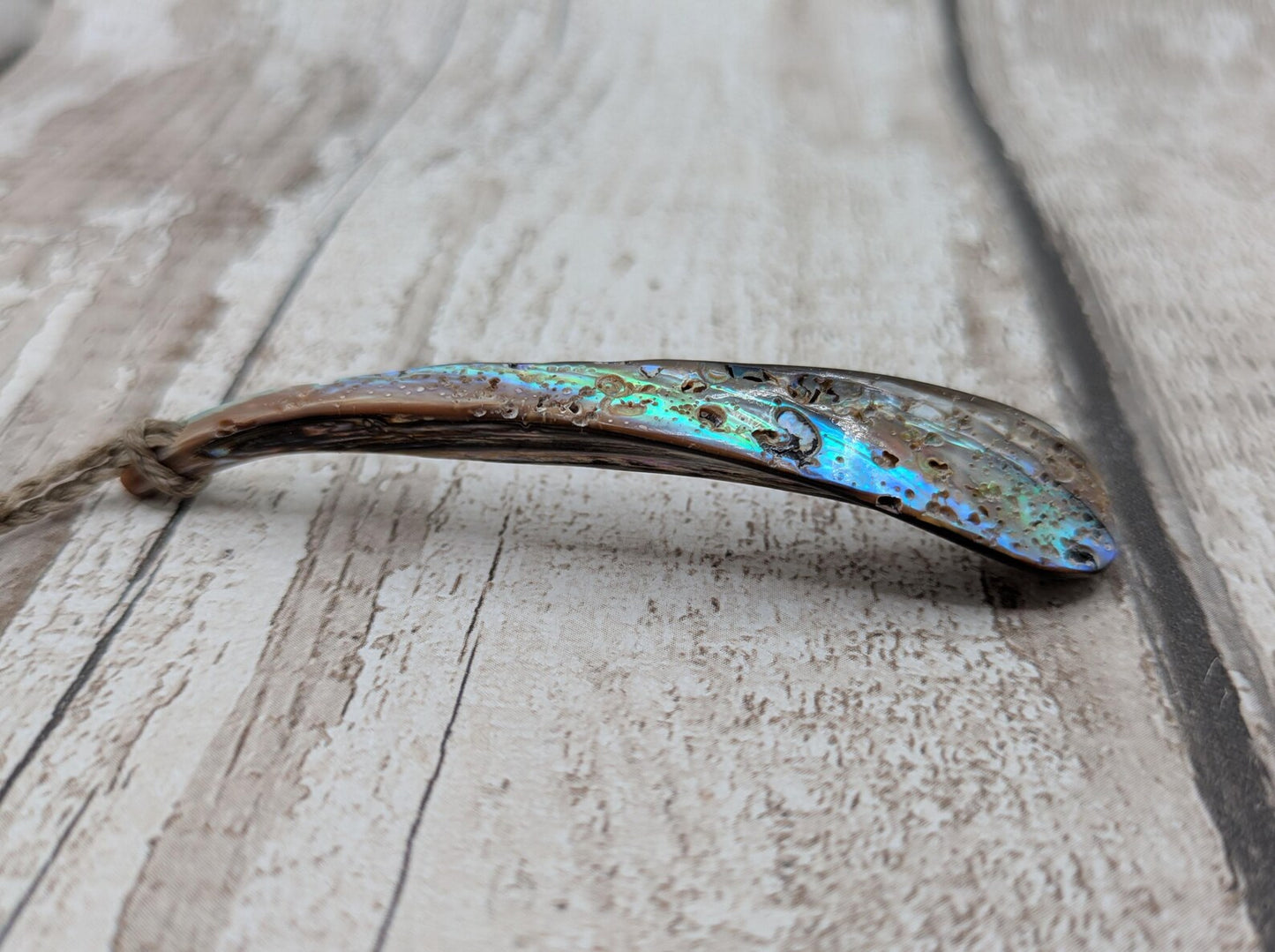 New Zealand rainbow pāua rim drop pendant.